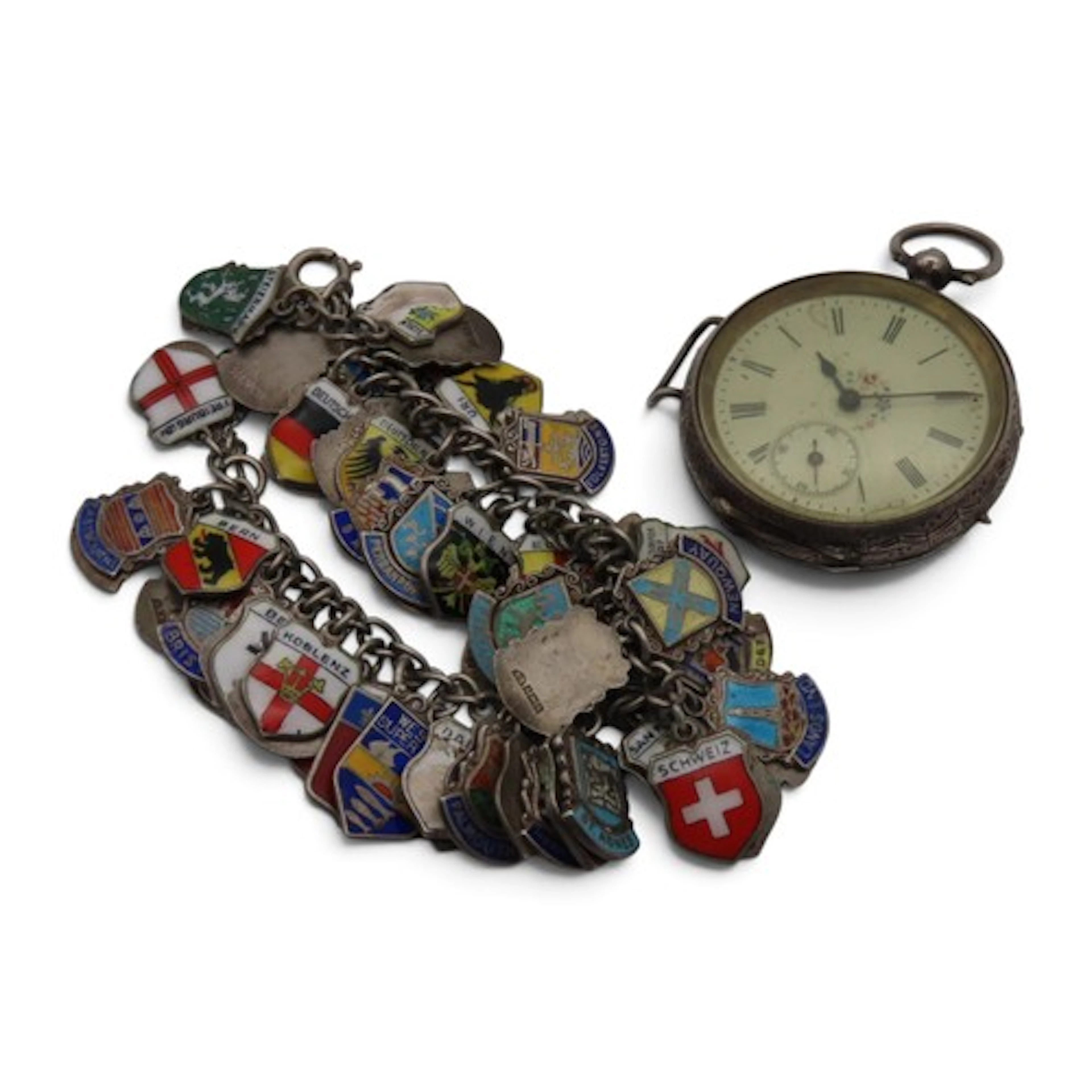 An unmarked silver charm bracelet, suspended with enamel cha...