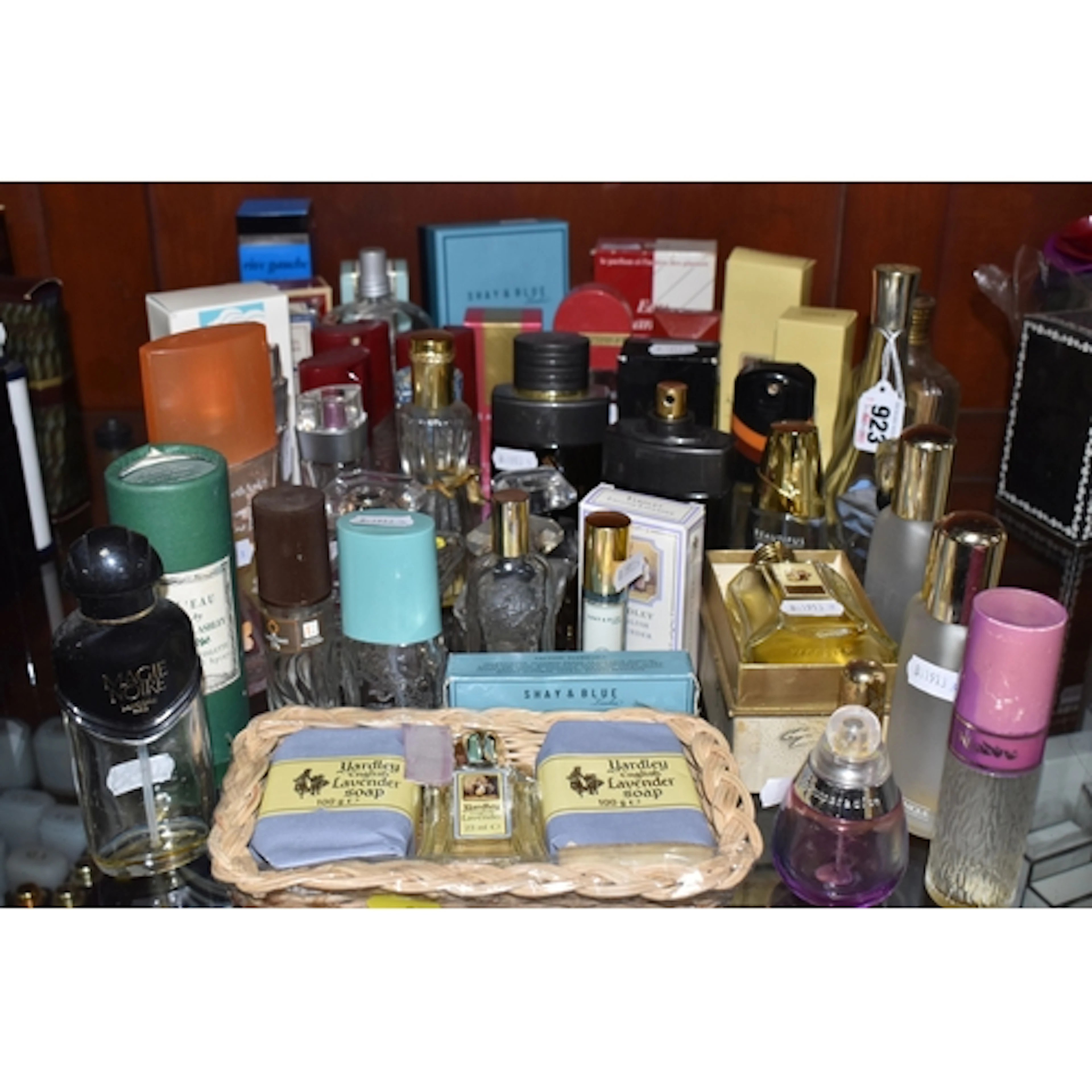 A COLLECTION OF MOSTLY EMPTY LADIES' PERFUME BOTTLES, to inc...