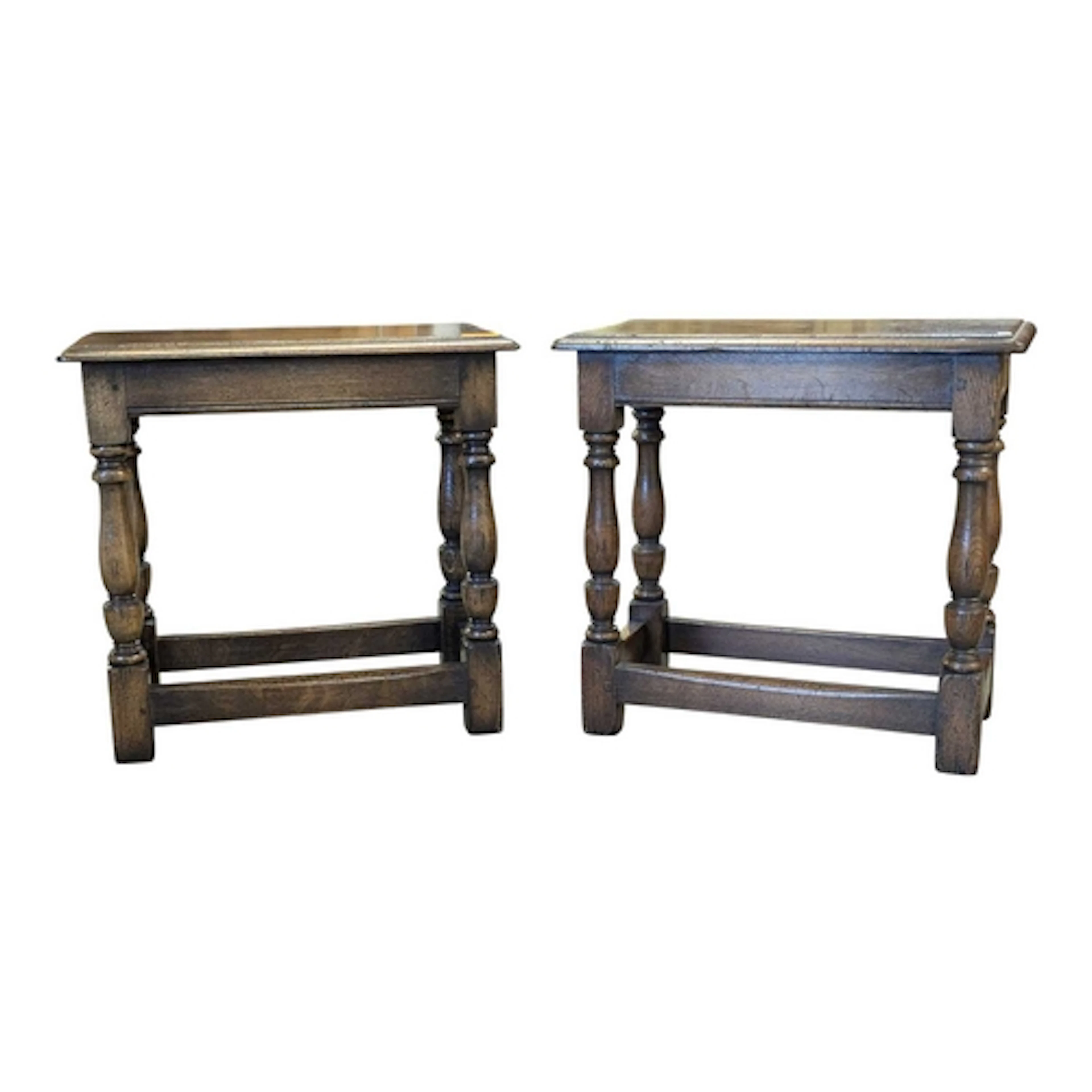A pair of Ipswich oak Jacobean revival joint stools. Each ra...