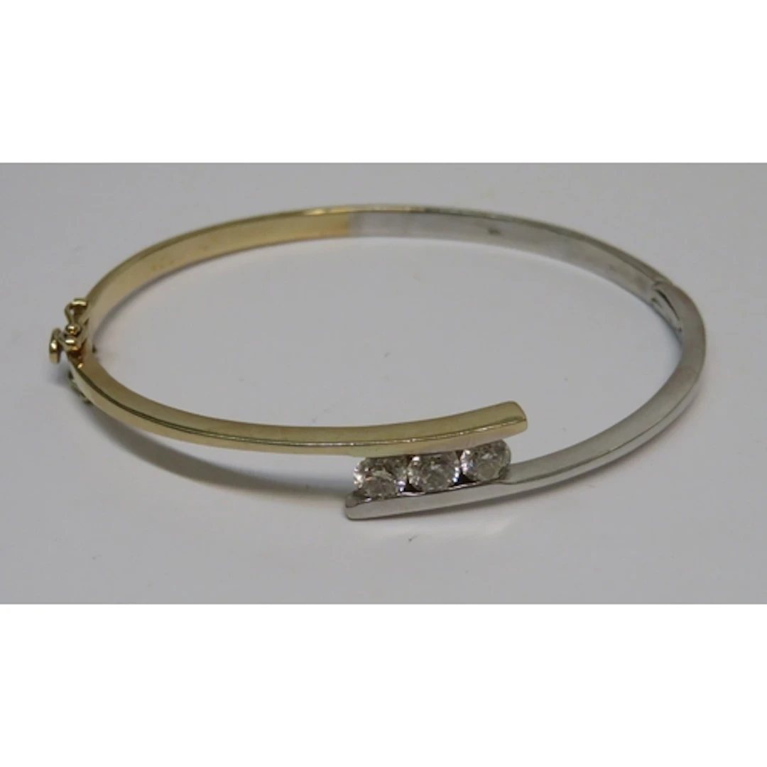 14ct two colour gold bangle set with three brilliant cut dia...