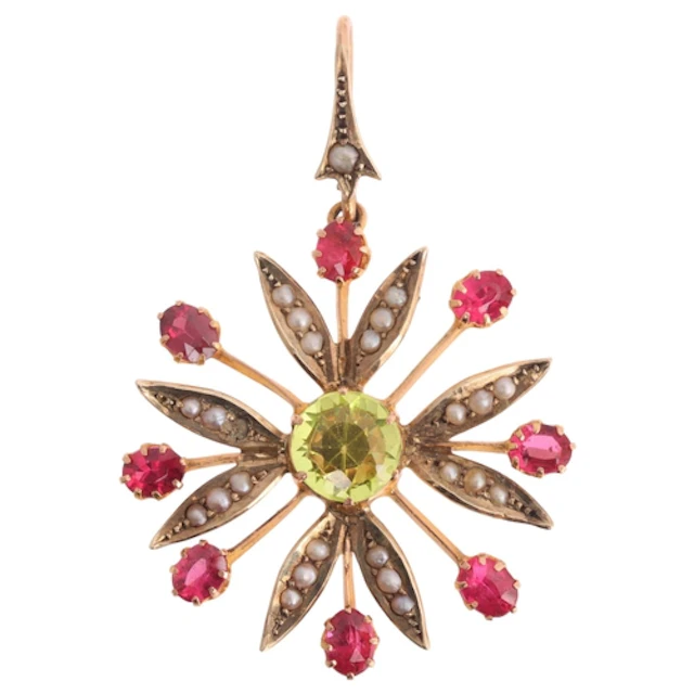 An Art Nouveau 9ct gold peridot corundum doublet and split p...