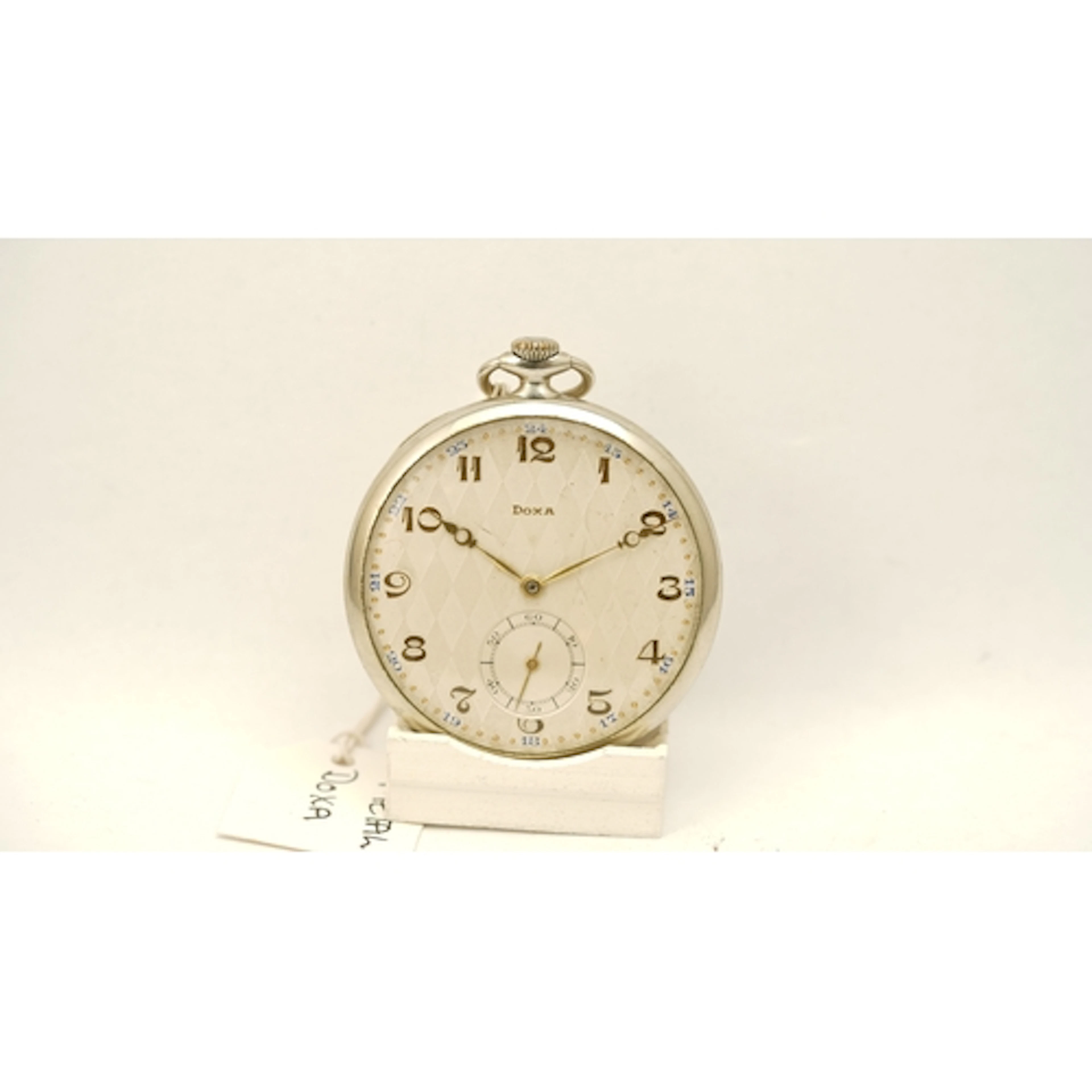 Doxa open face pocket watch. 49mm. Diamond pattern dial with...