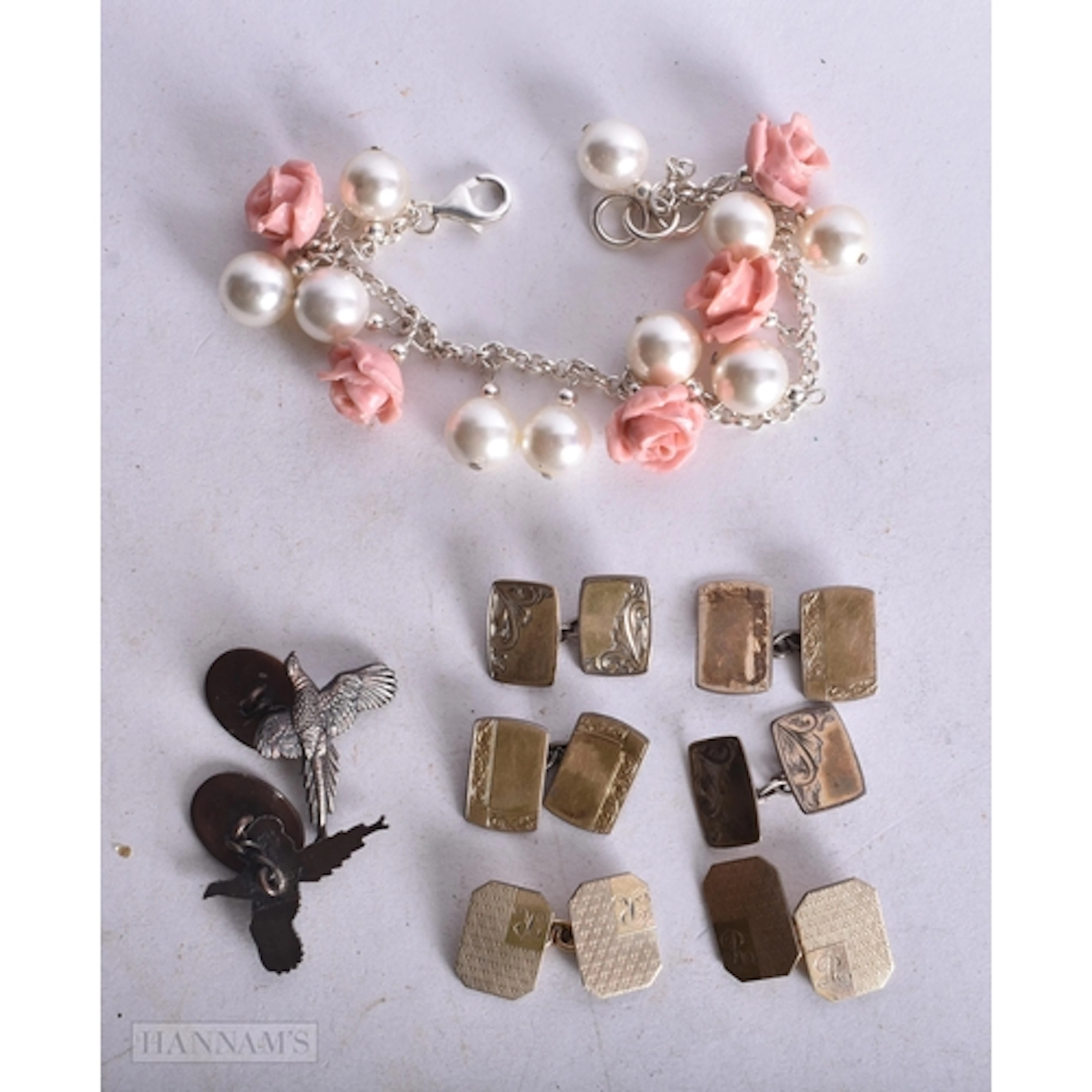 SILVER CUFFLINKS and a silver faux pearl bracelet. 58 grams....