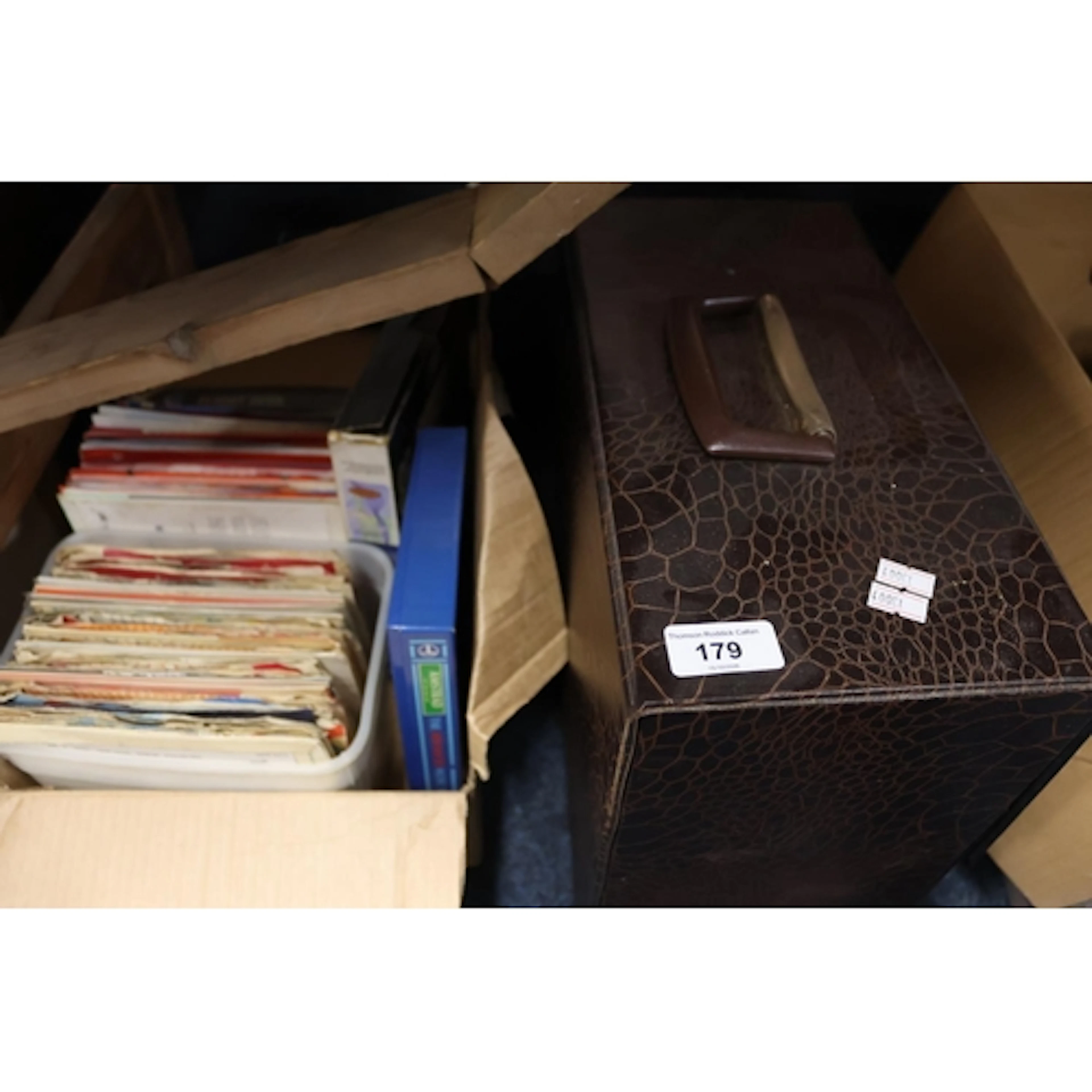Music case containing vinyl records, singles, etc.
