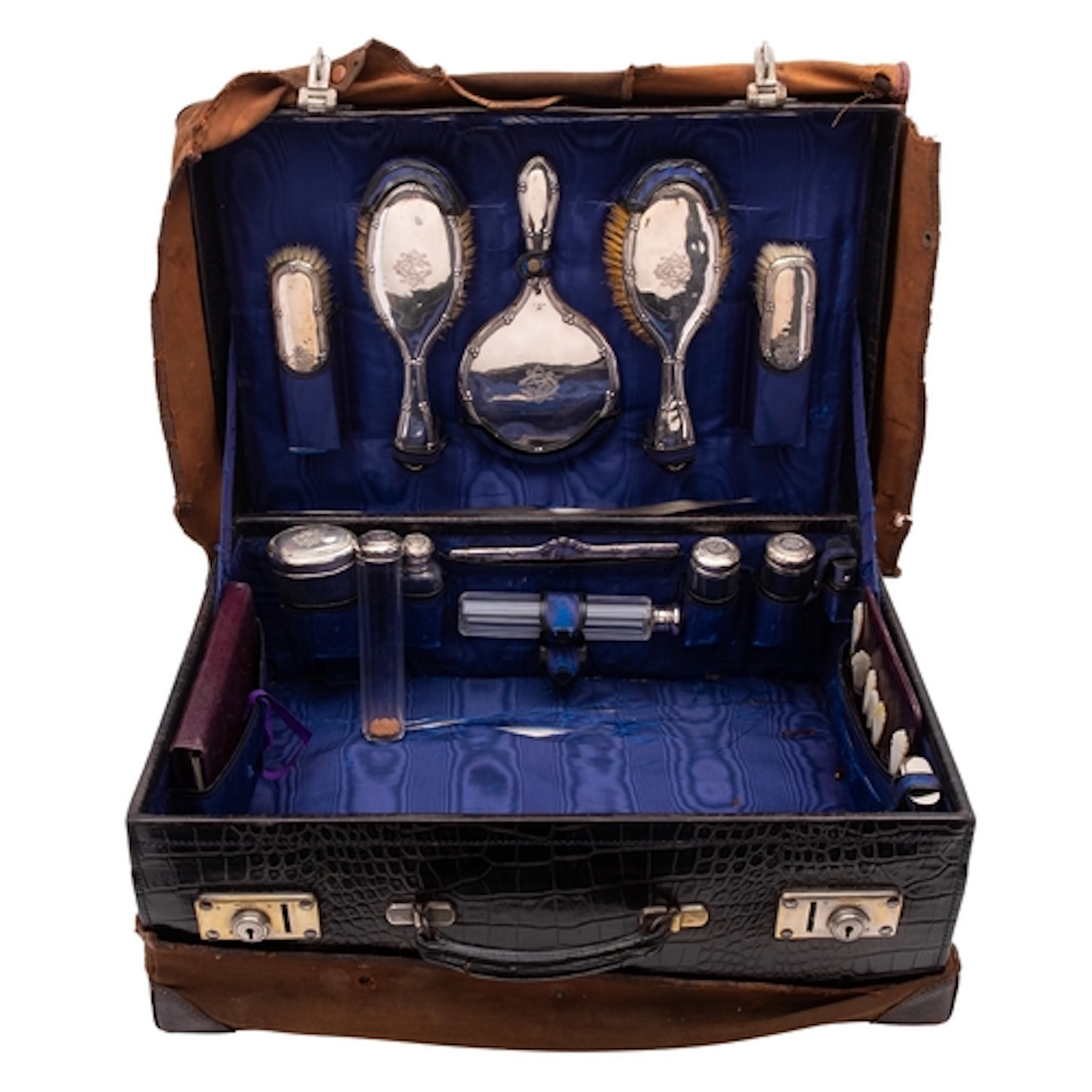 An early 20th century black crocodile leather dressing case,...