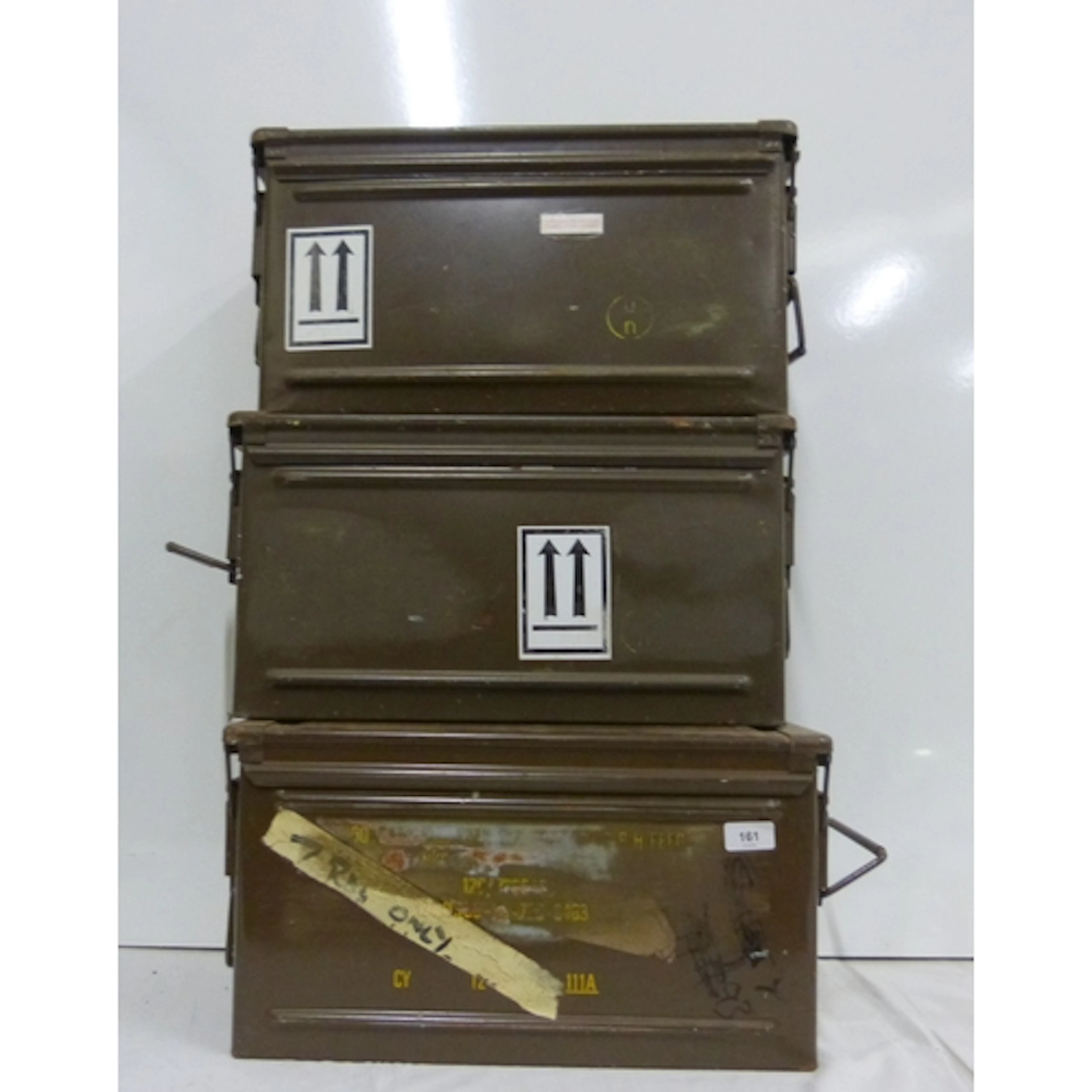 Three vintage military ammunition boxes.