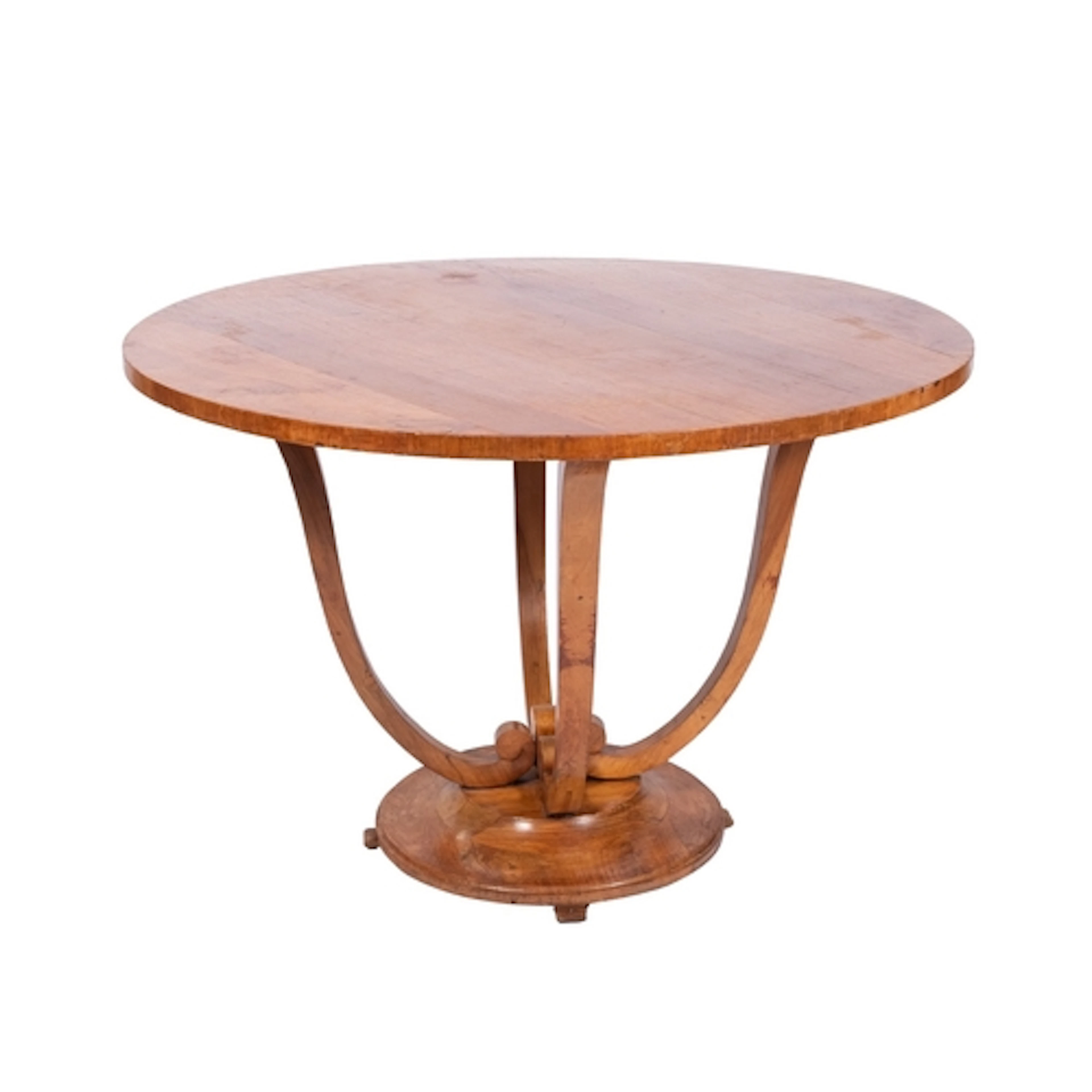 An Art Deco walnut circular dining table in the manner of Ju...