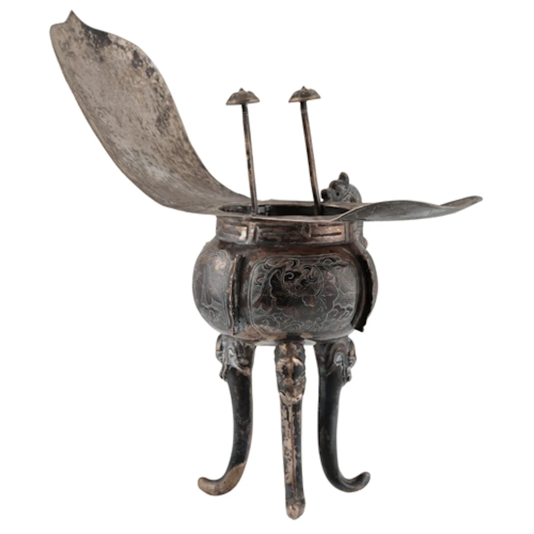 An early 20th century Chinese white metal tripod vessel (Jue...