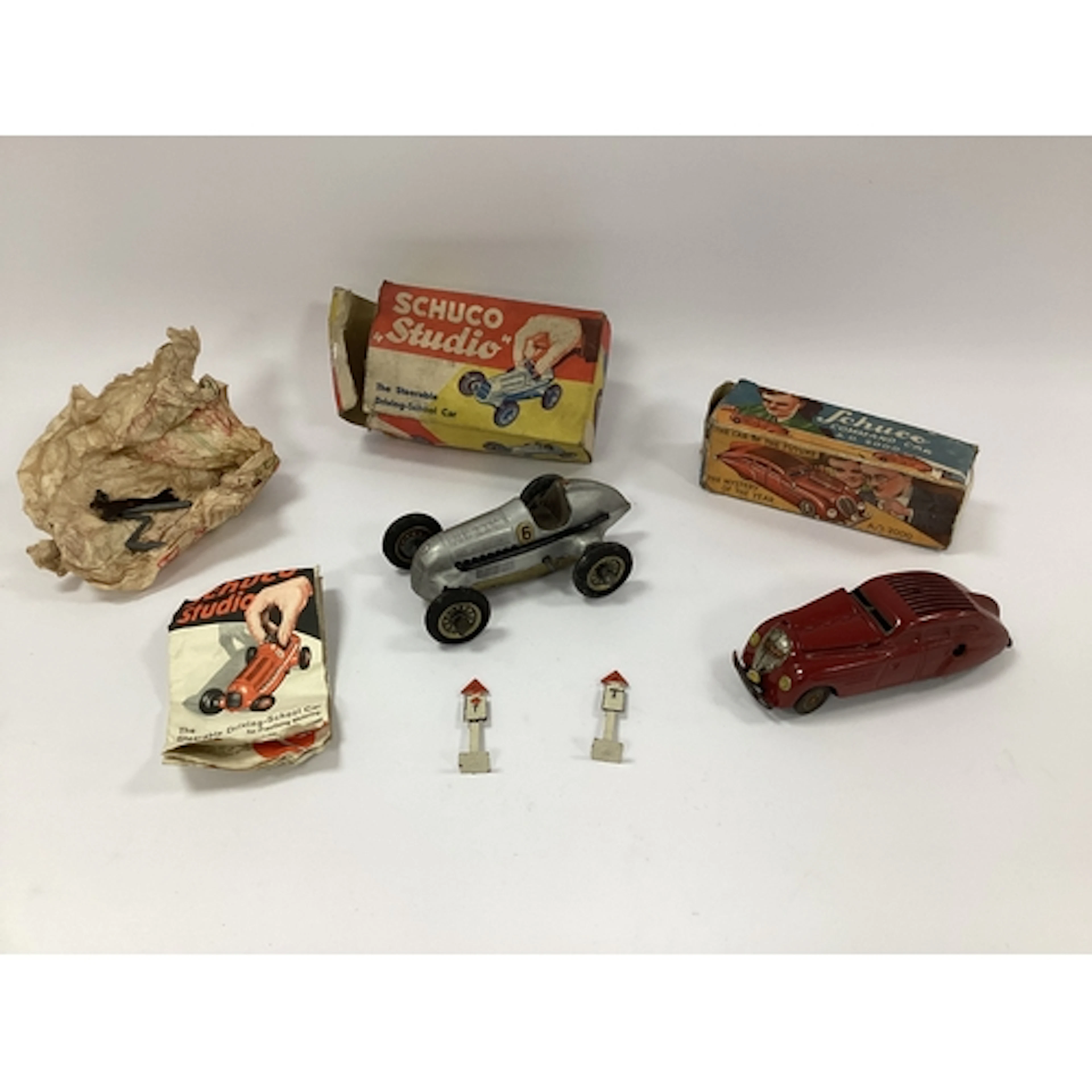 An Original Schuco Studio clockwork car, Playworn, missing s...
