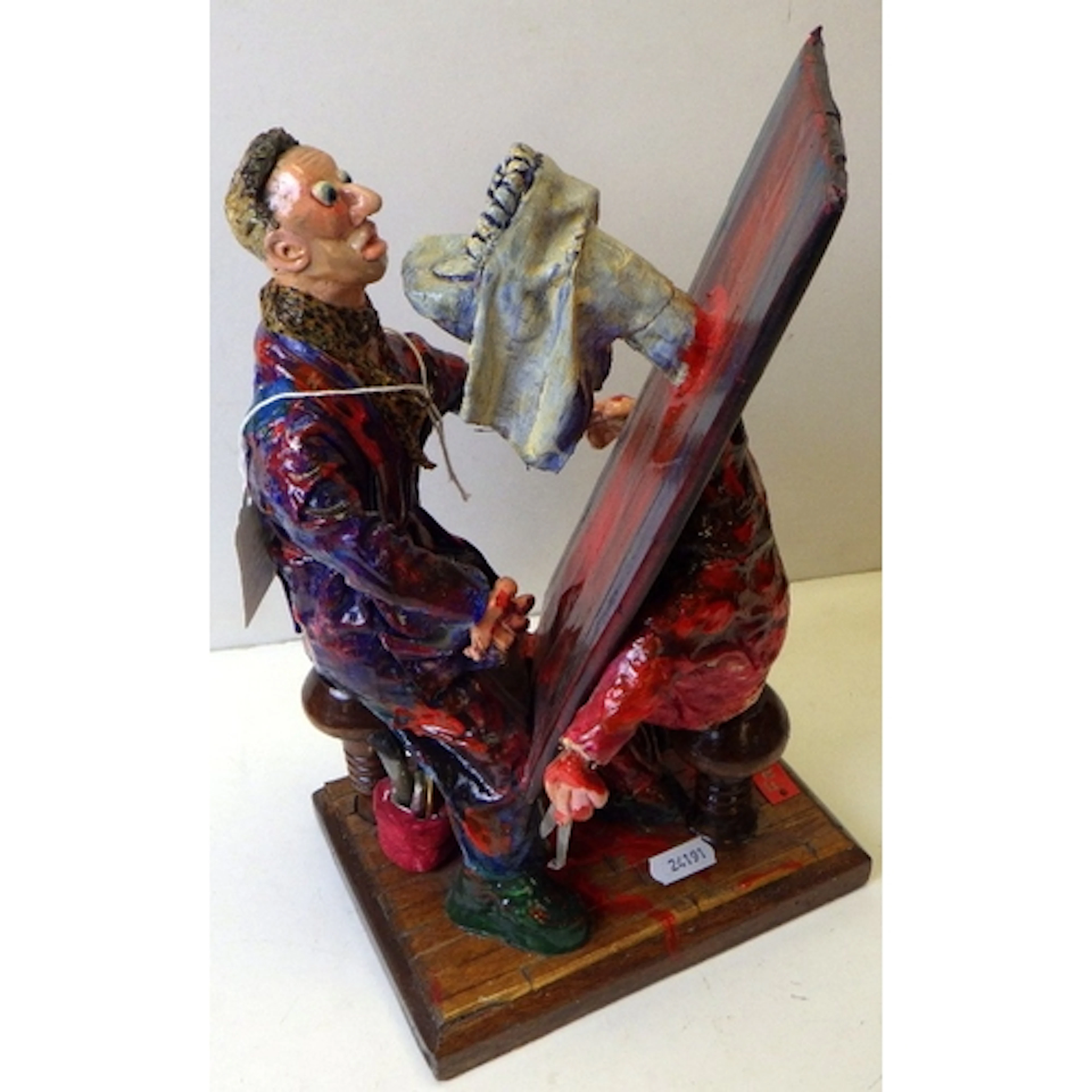 A grotesque dentist papier-mâché figure