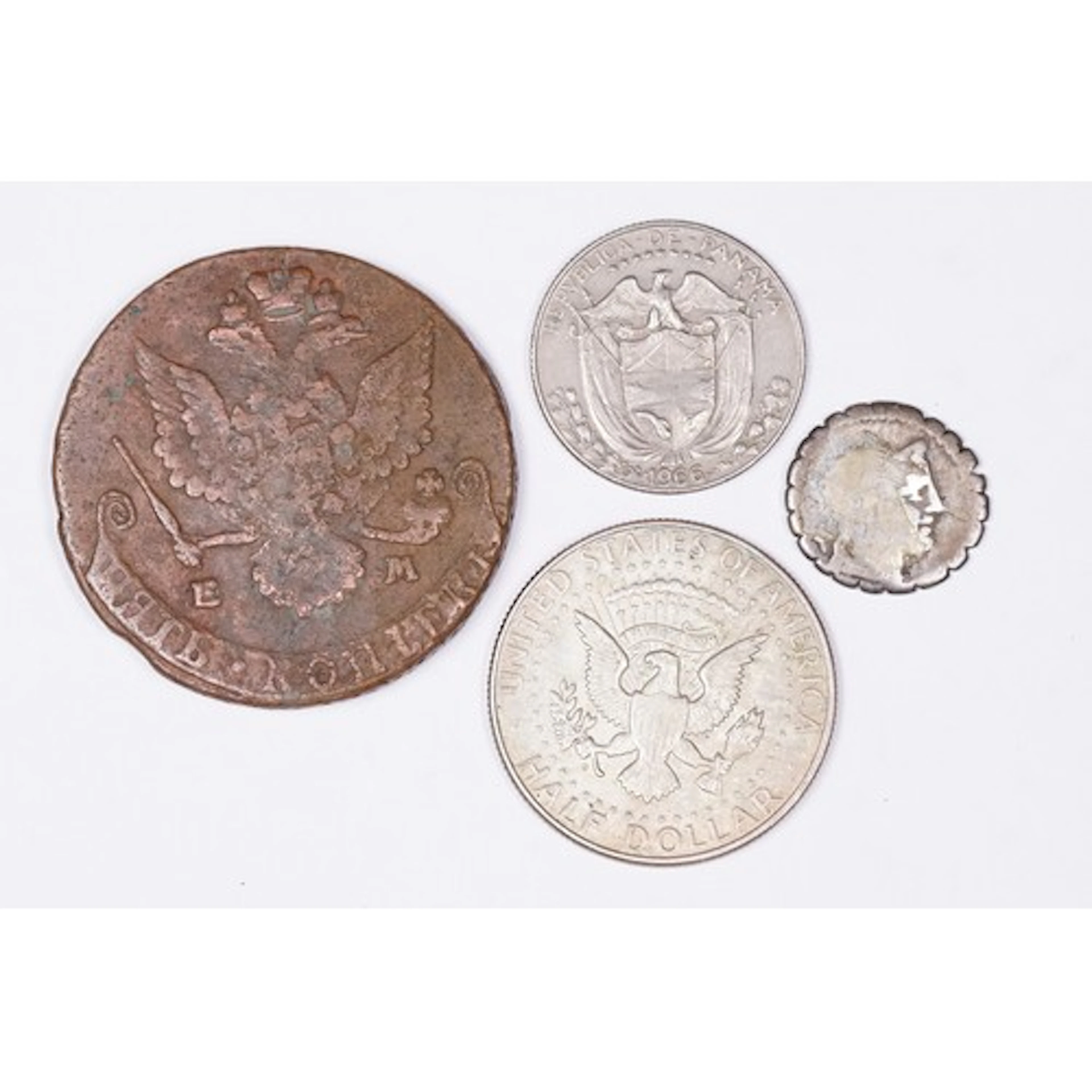 A small collection of four coins to include a Russian 1780 c...