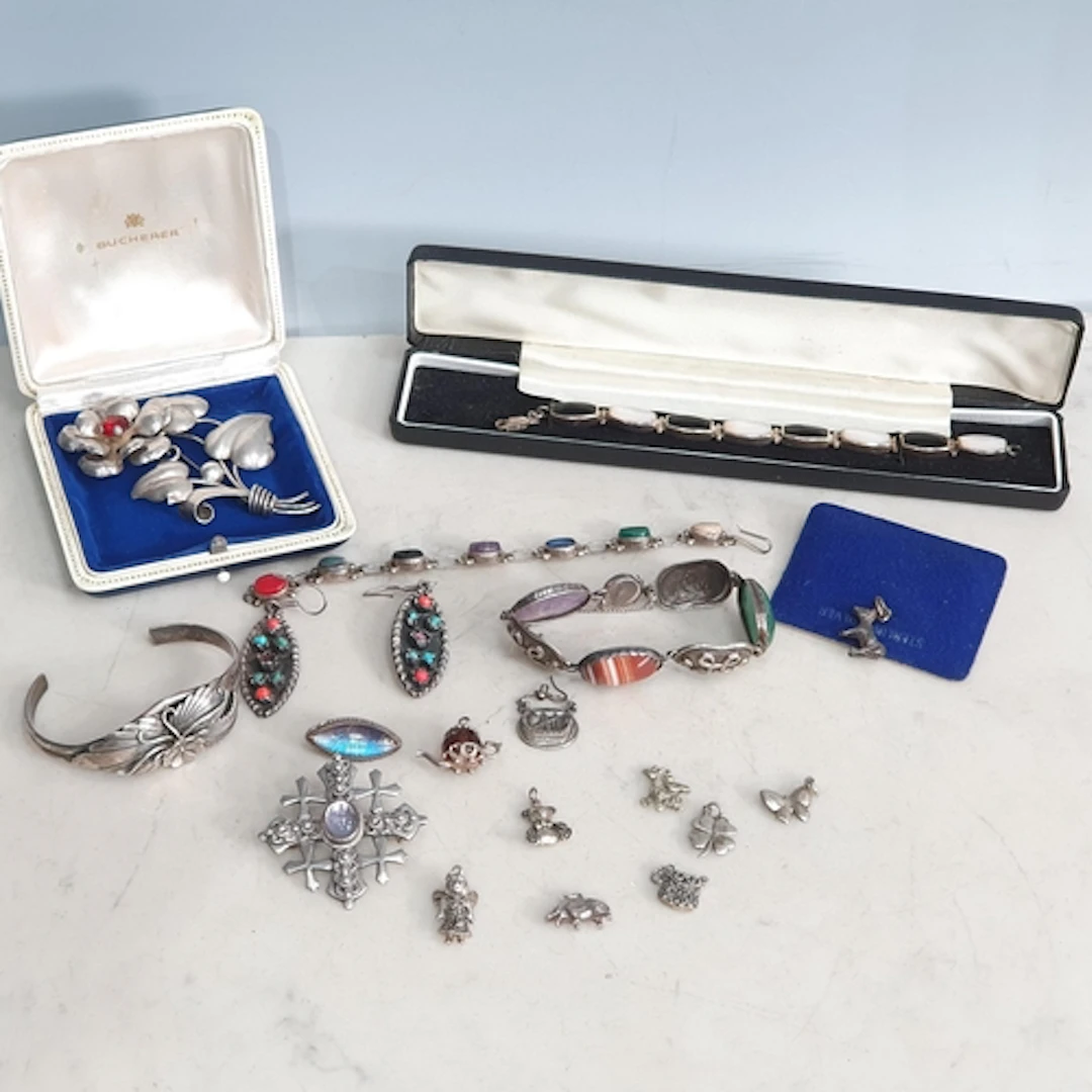 A large silver floral Brooch set red stone stamped 'STERLING...