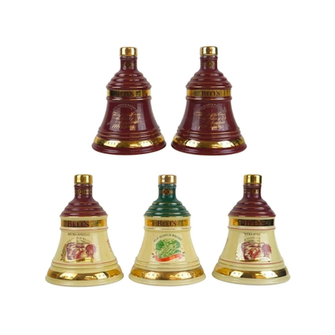 Five sealed Bell's Scotch Whisky decanters. Each in a cardbo...