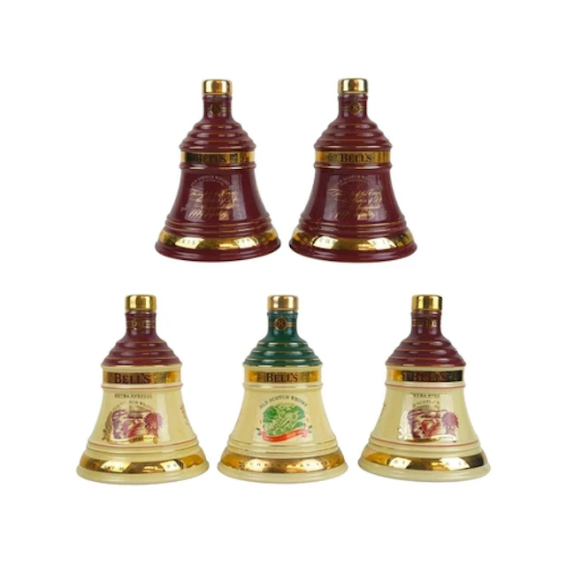 Five sealed Bell's Scotch Whisky decanters. Each in a cardbo...