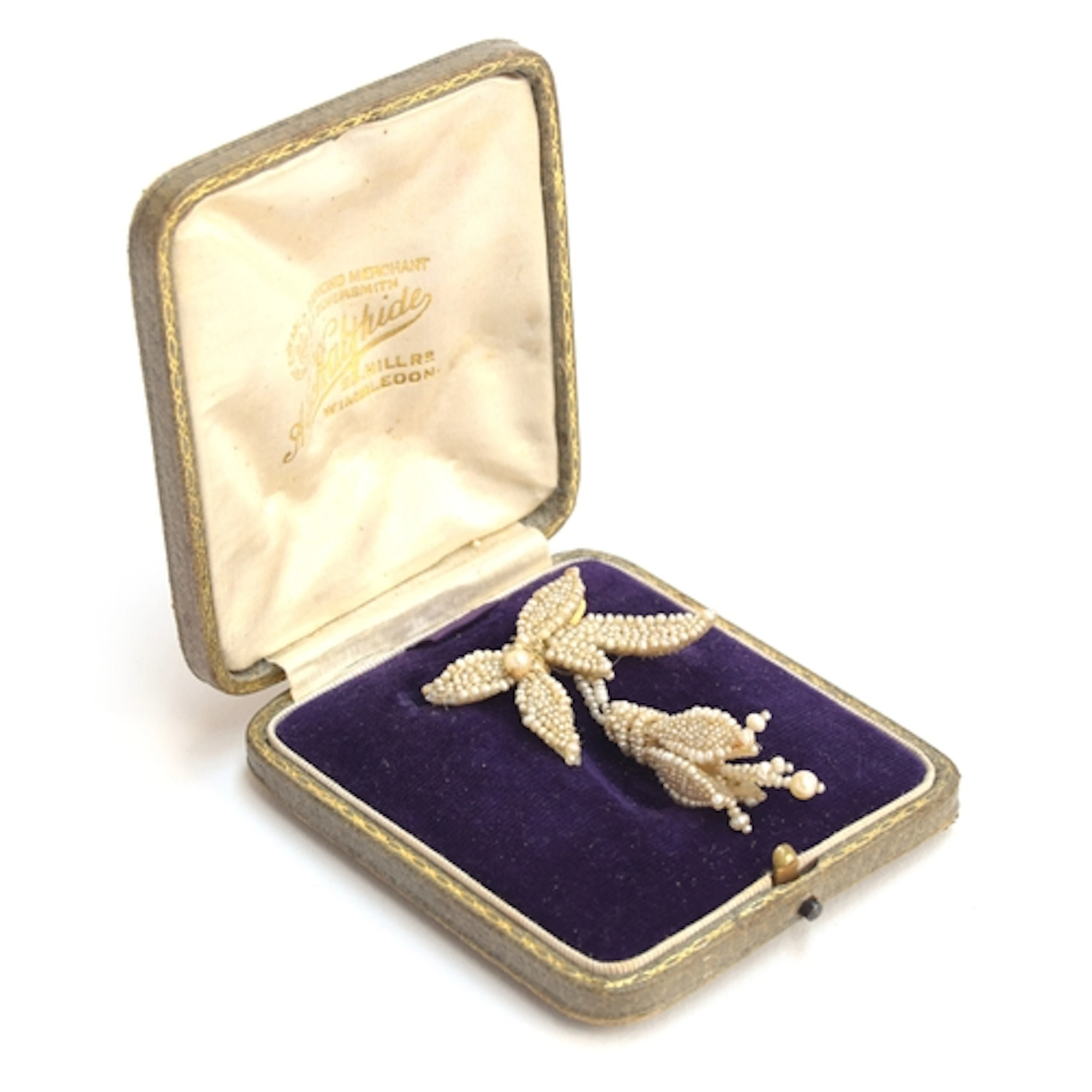 A 19th century seed pearl brooch in the form of a fuchsia fl...