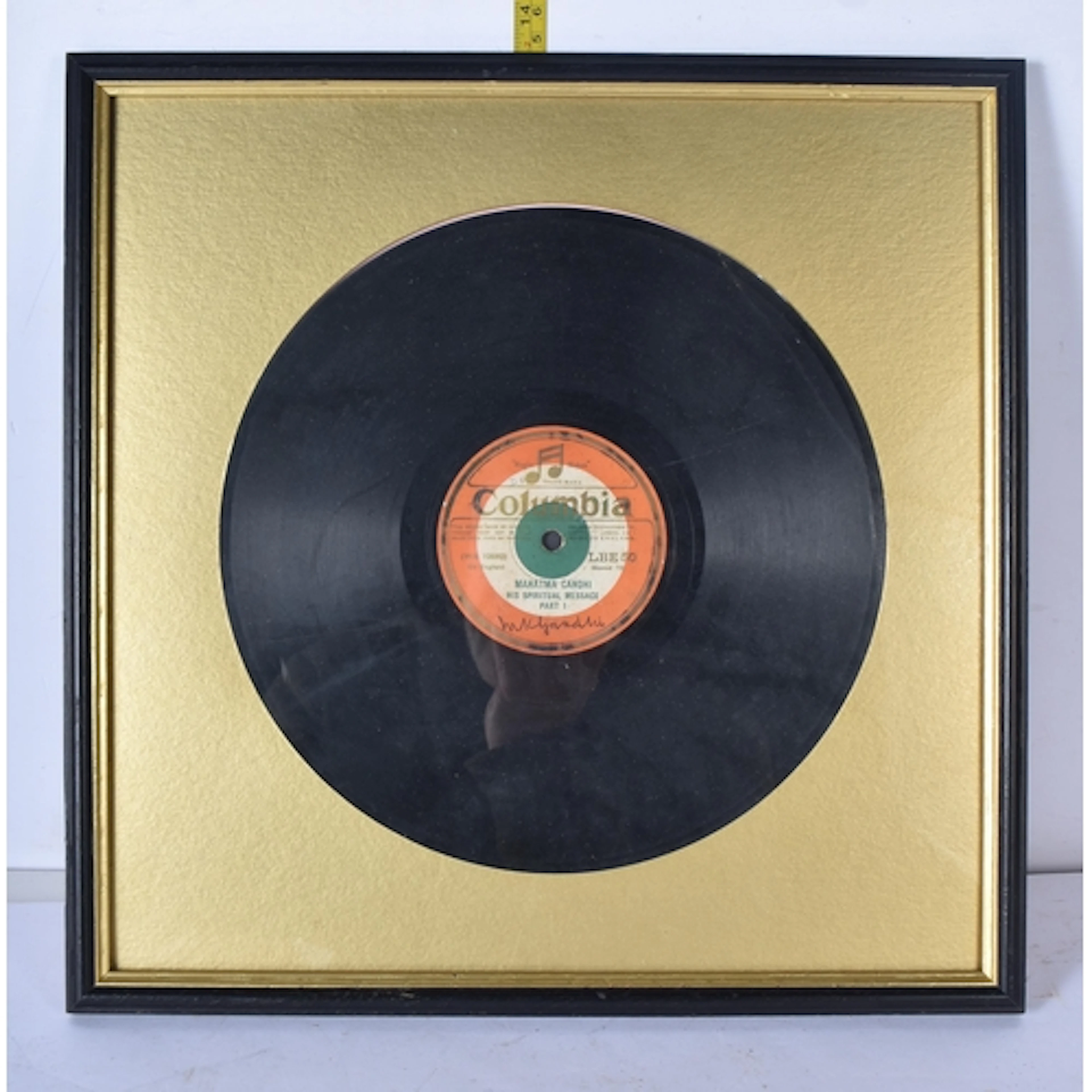 A framed signed vinyl 78 "A spiritual message by Mahatma Gan...