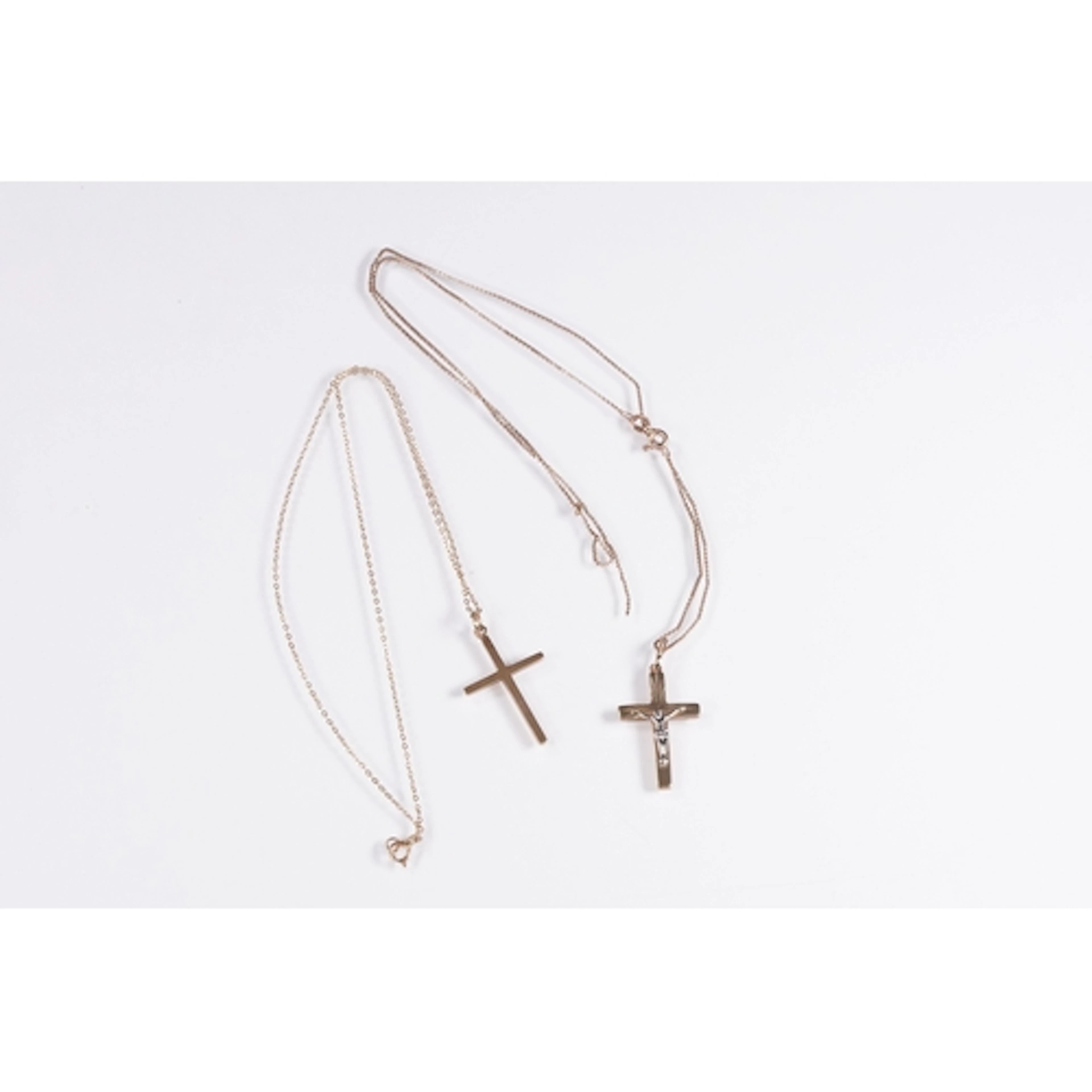 Two 9ct gold cross pendant necklaces to include a two tone c...