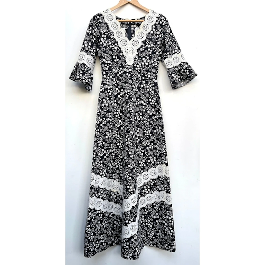 A vintage black and white dress in a floral print with lace ...