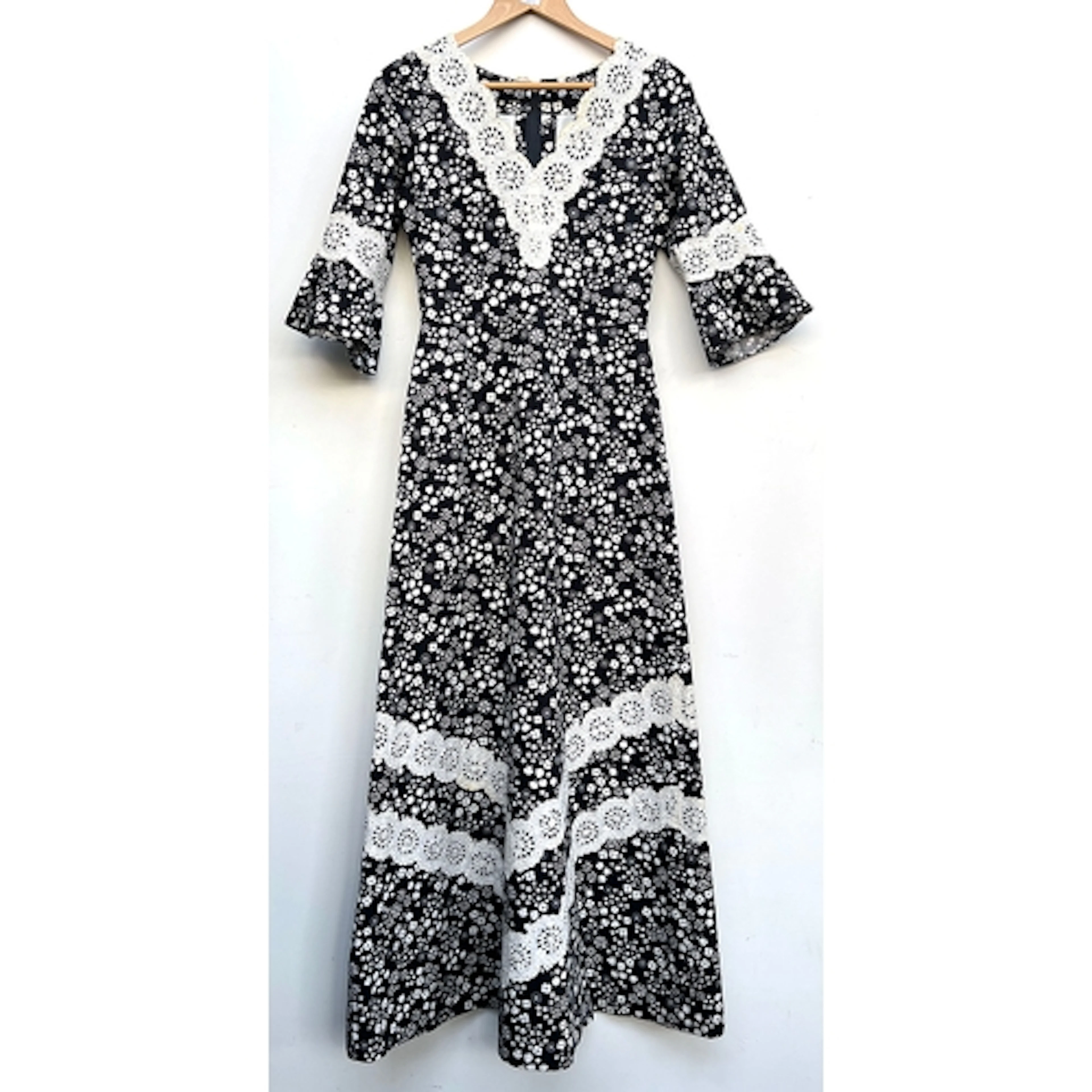 A vintage black and white dress in a floral print with lace ...
