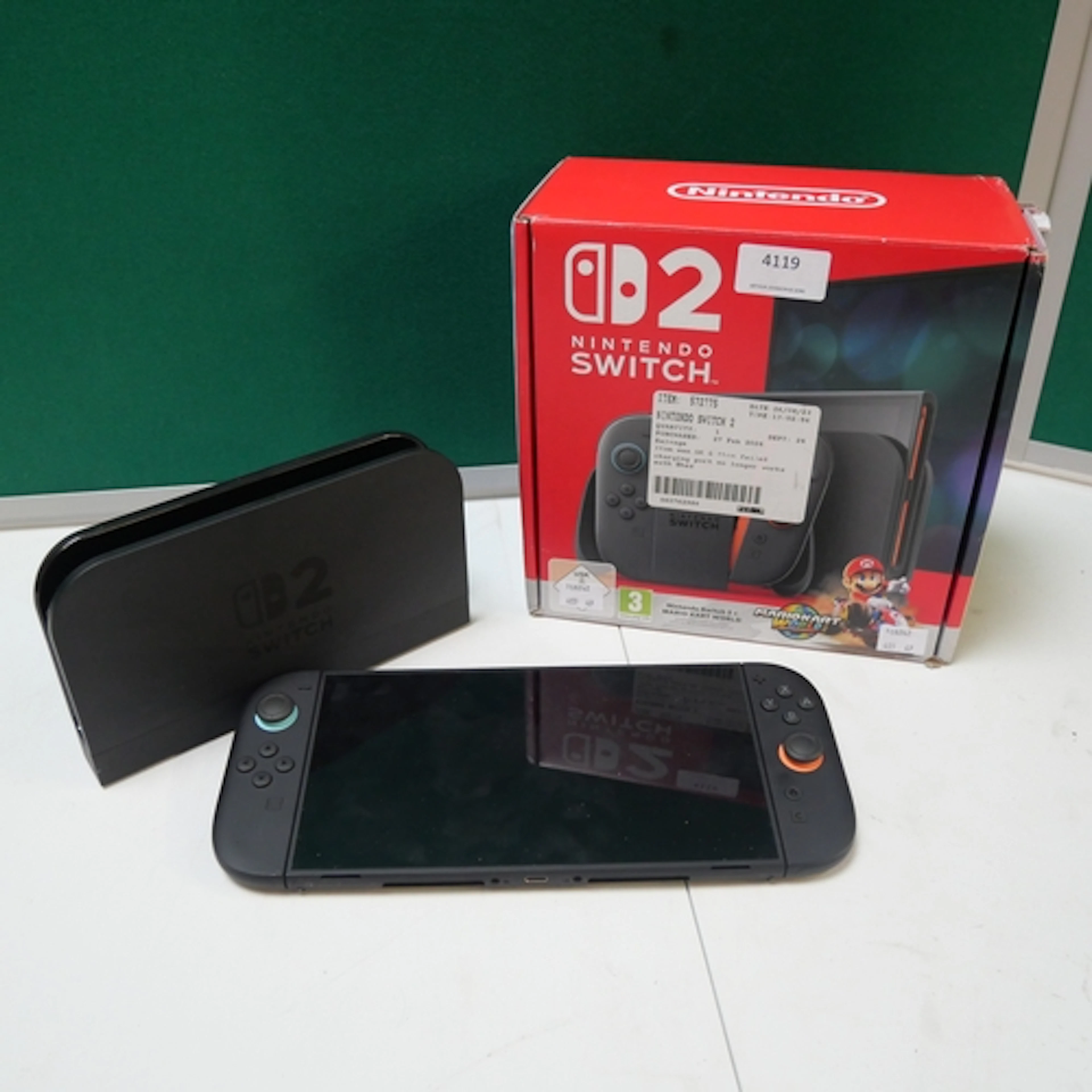 A Nintendo Switch 2 console with docking station and control...