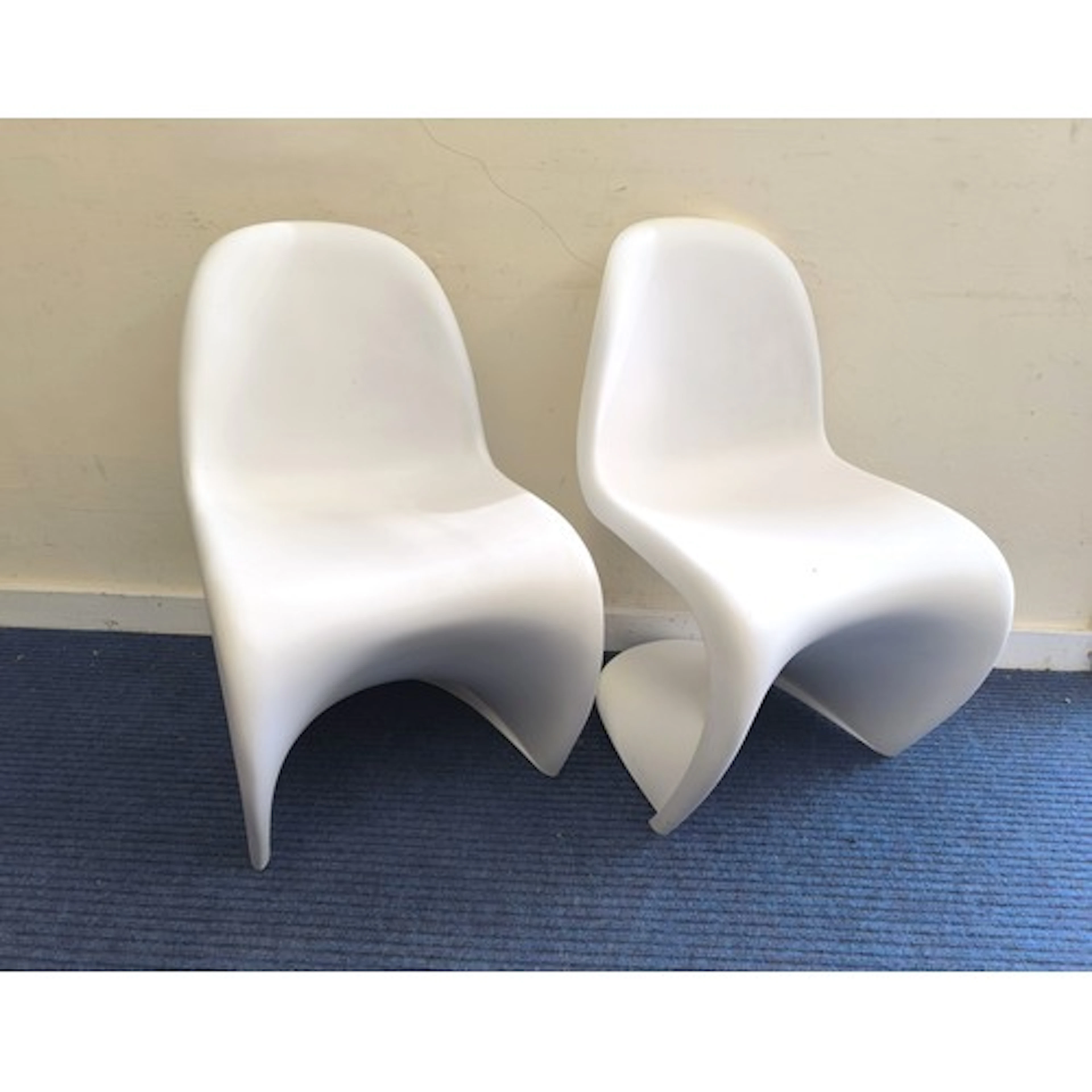 A pair of Vitra for Verner Panton white plastic S chairs. Bo...