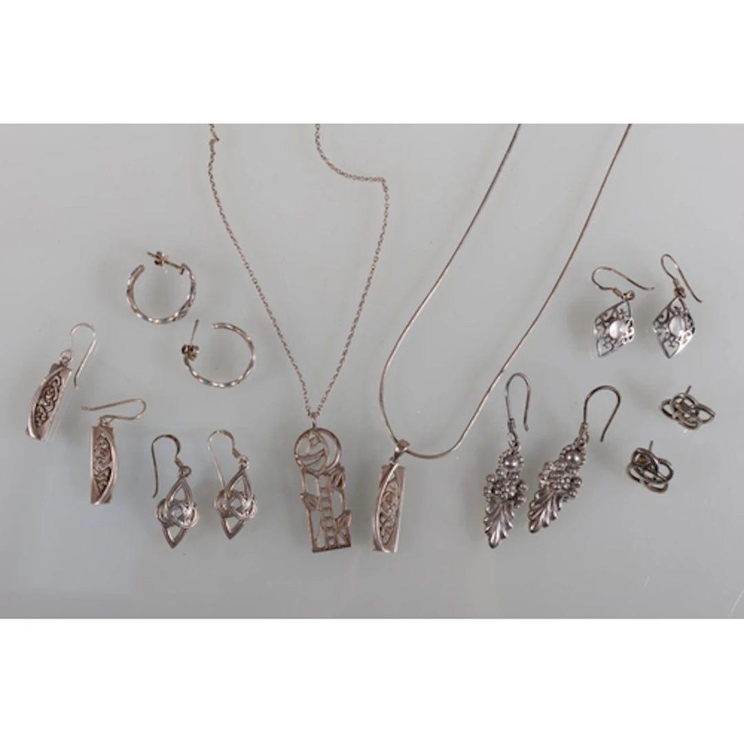 Silver Charles Rennie Mackintosh design rose pendant on chai...