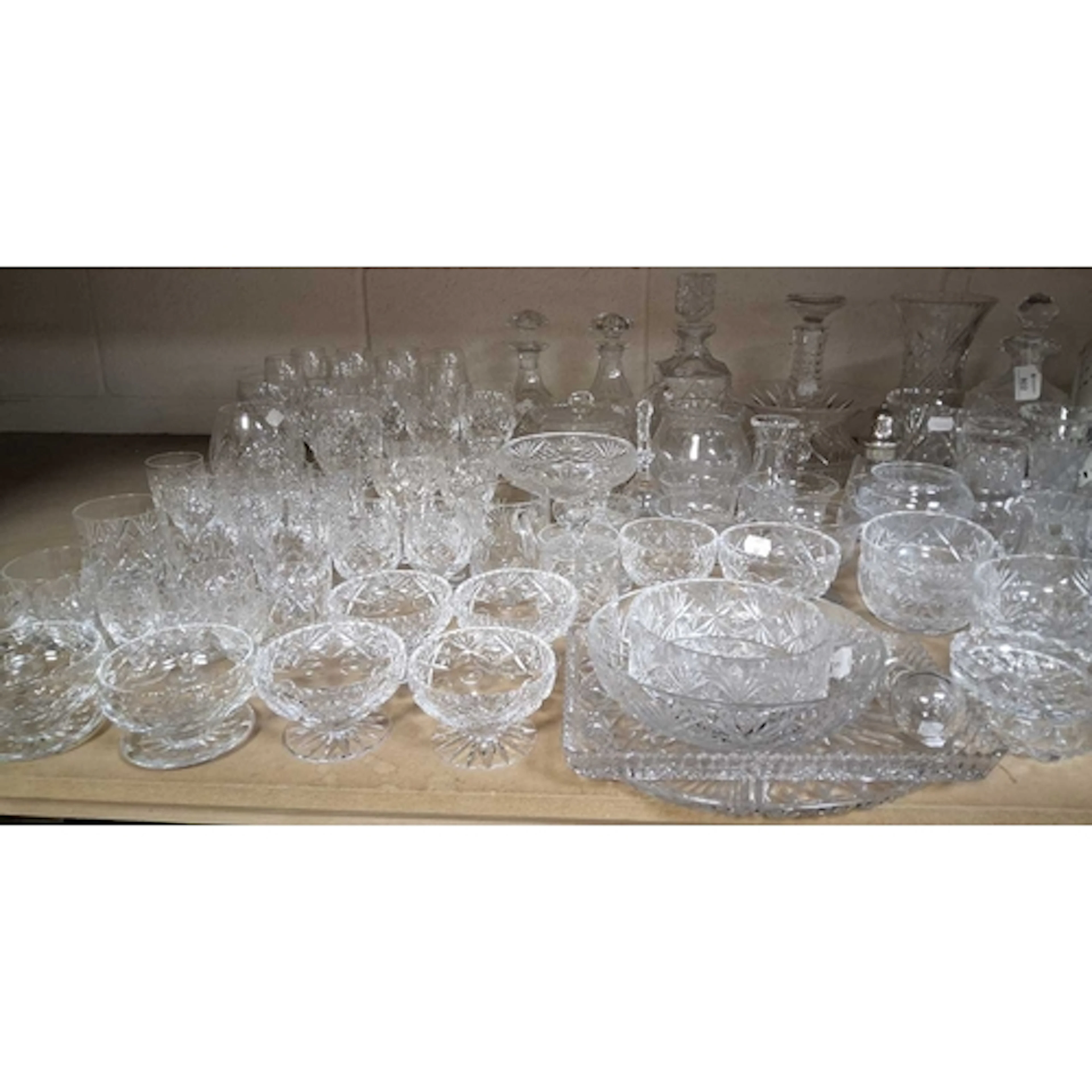 A QUANTITY OF CUT CRYSTAL, to include drinking glasses, deca...