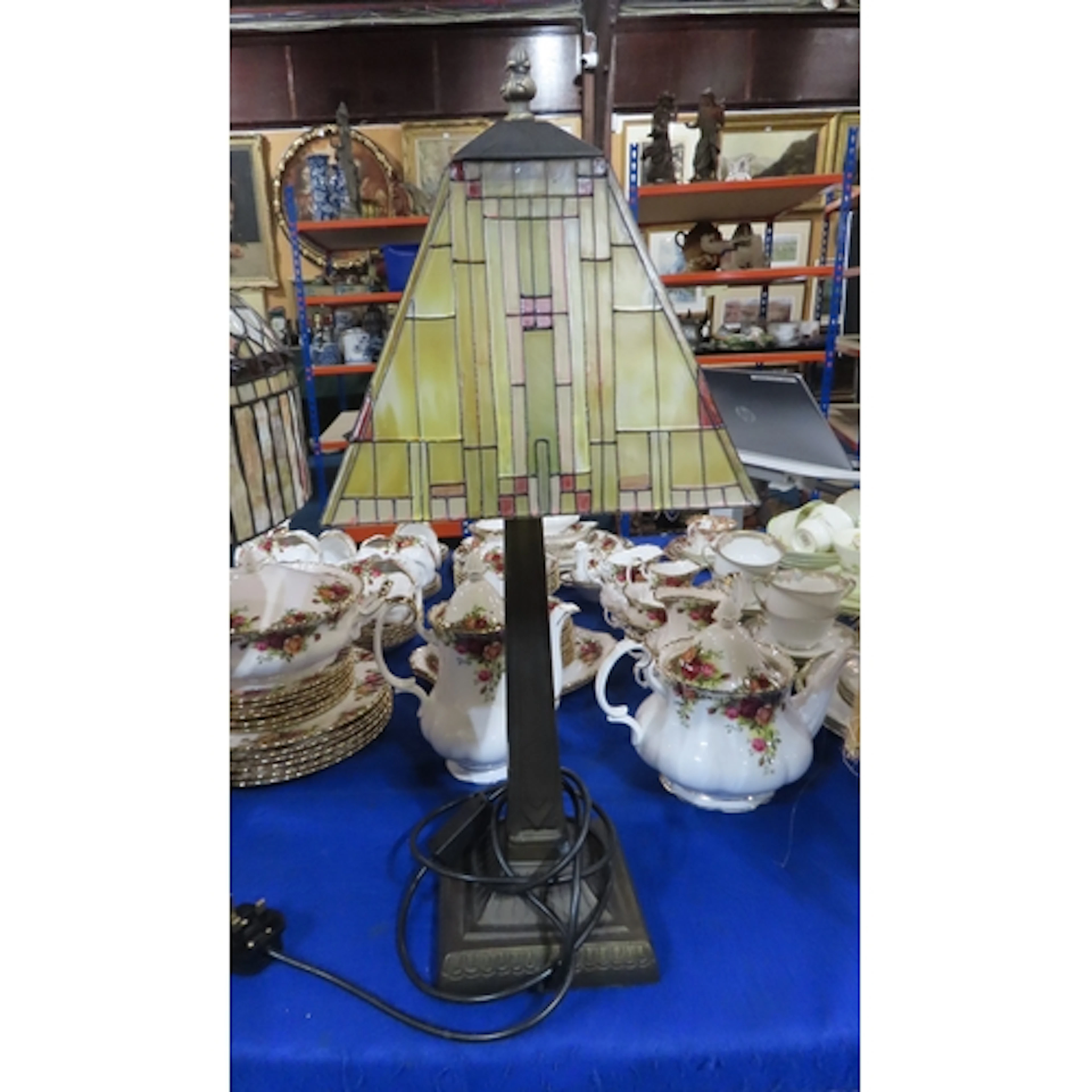 A stained glass table light in the style of Frank Lloyd Wrig...