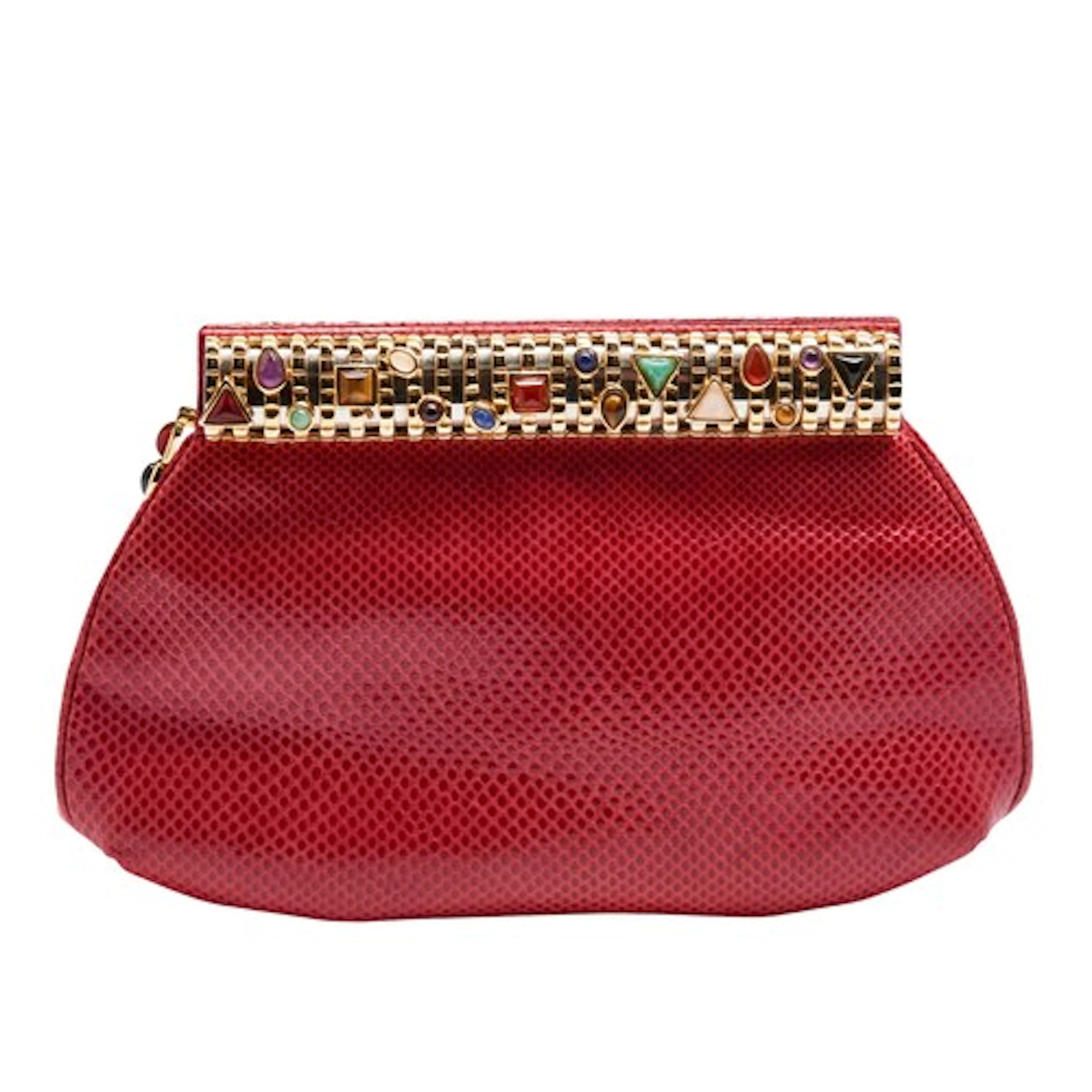 AN ORANGE LIZARD SKIN AND GEM SET CLUTCH BAG BY JUDITH LEIBE...