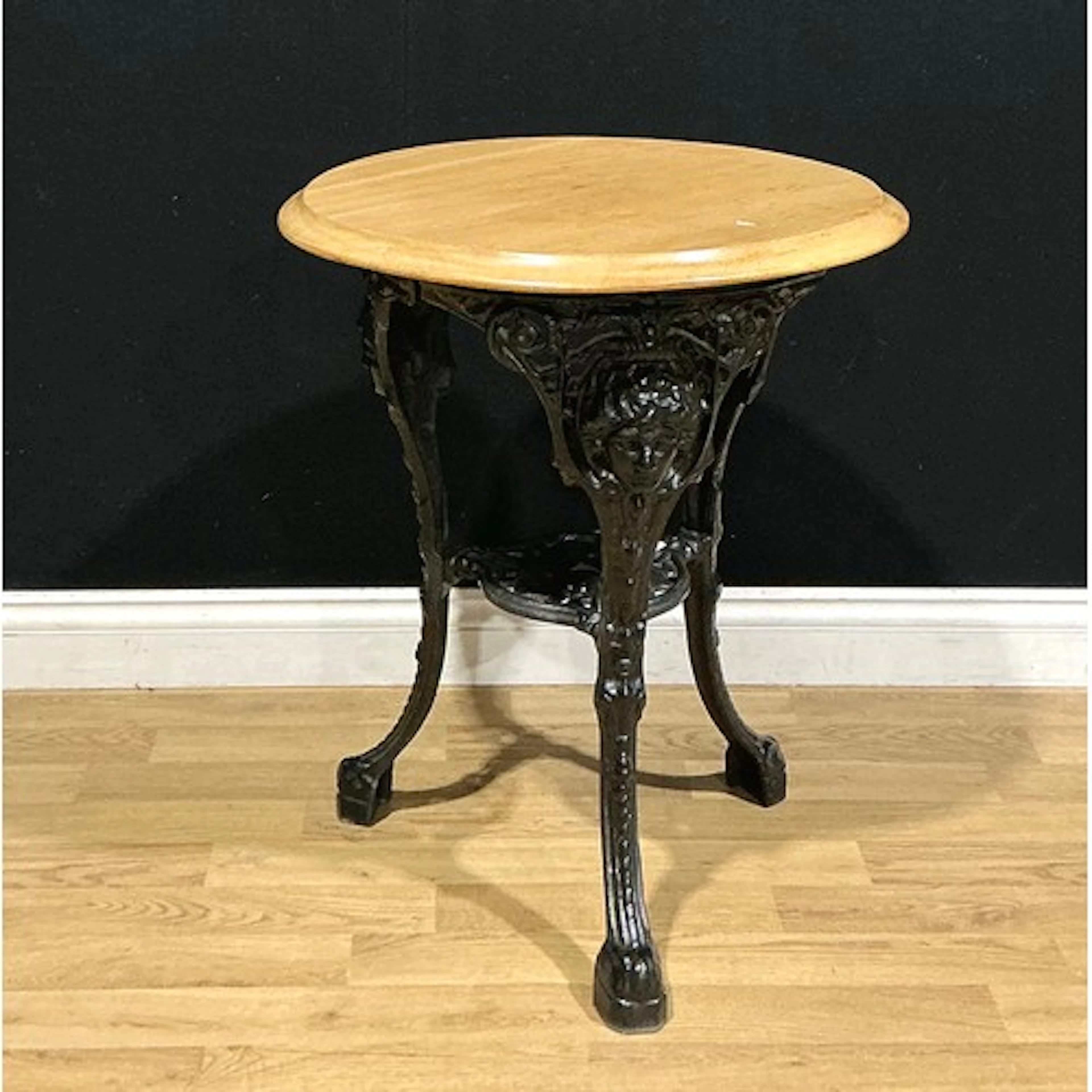 A Victorian style cast iron and hardwood pub table, 70cm hig...