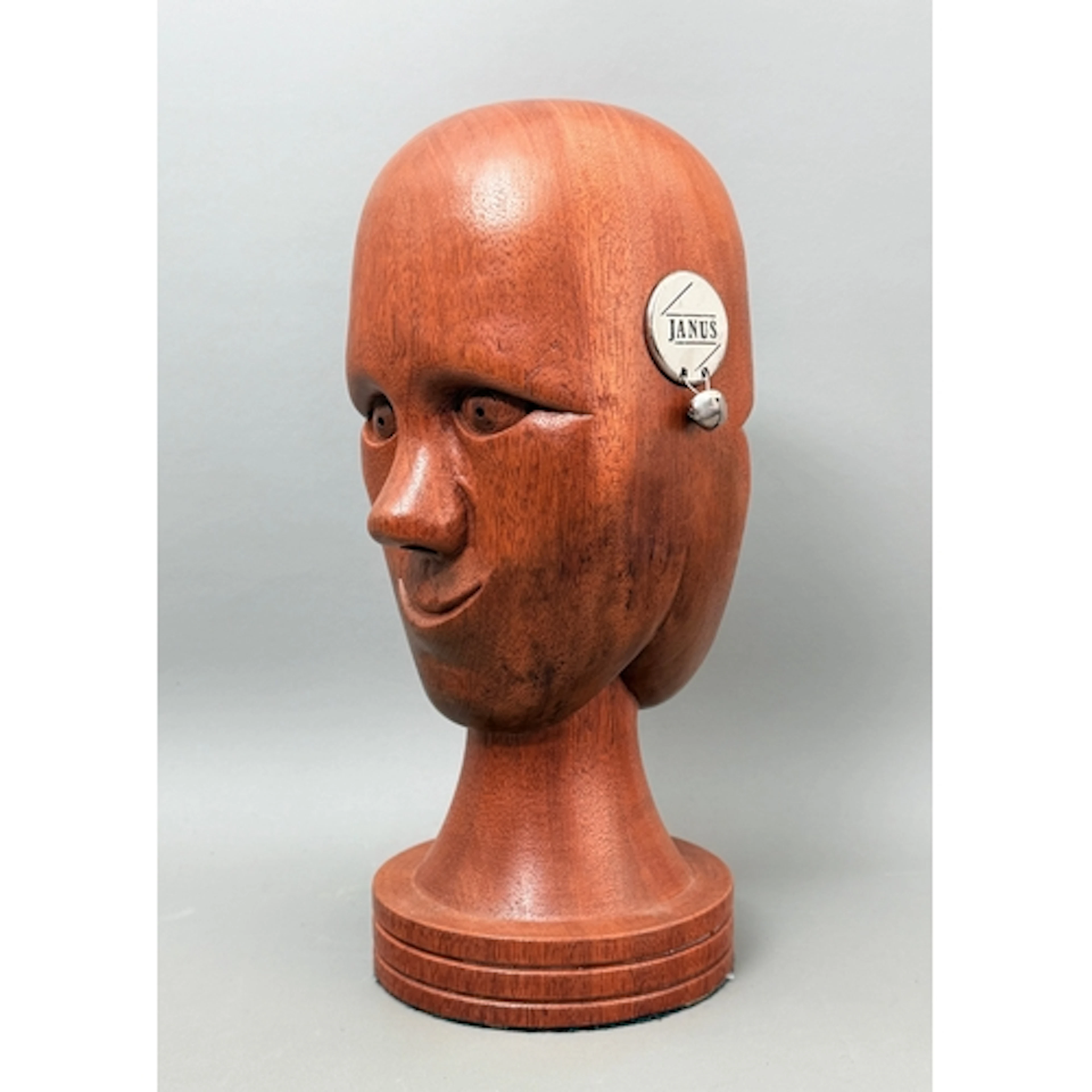 'Janus' by John Hoyle - a carved hard wood reversible head s...