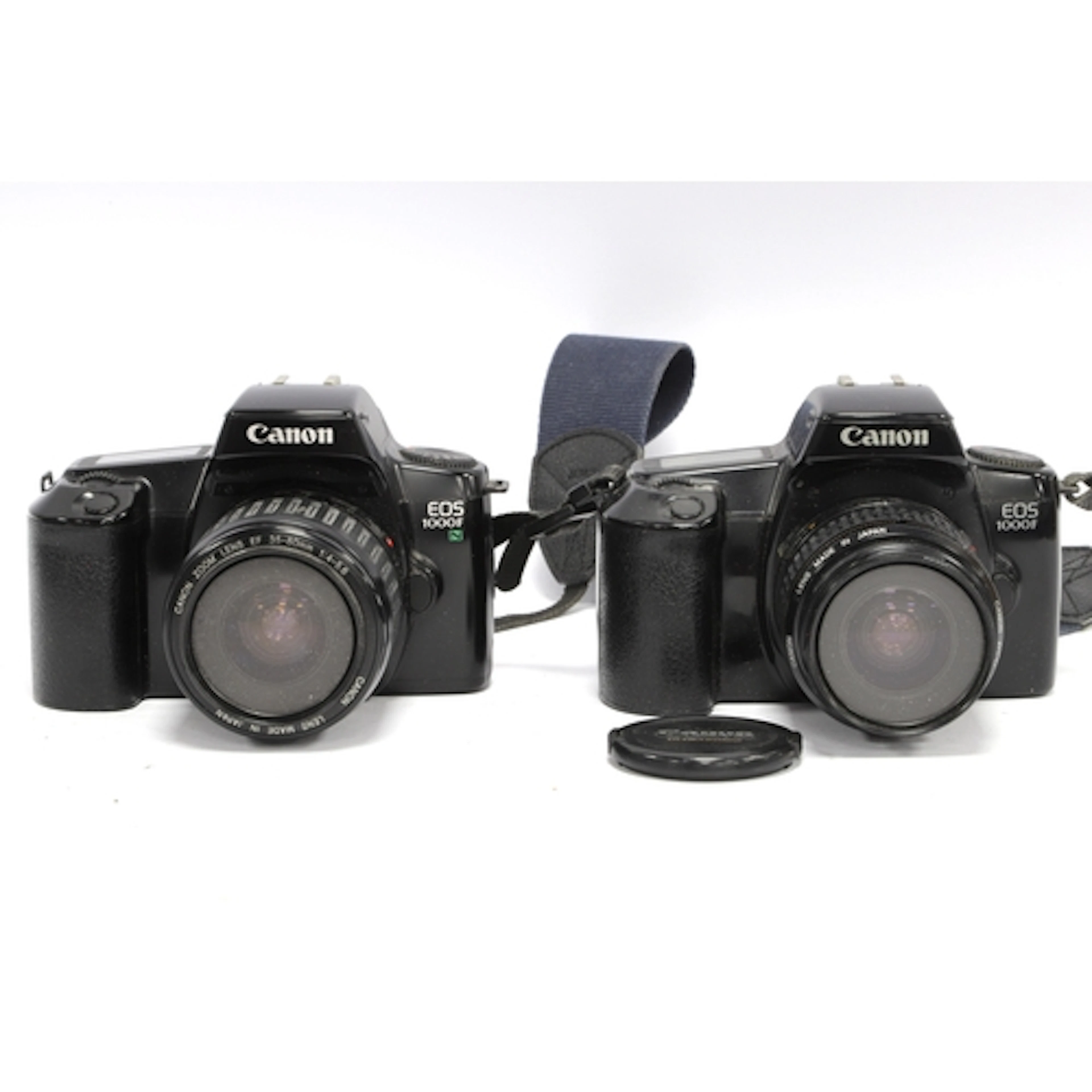 Canon EOS 1000F 35mm SLR Film Camera with attached Canon 35-...