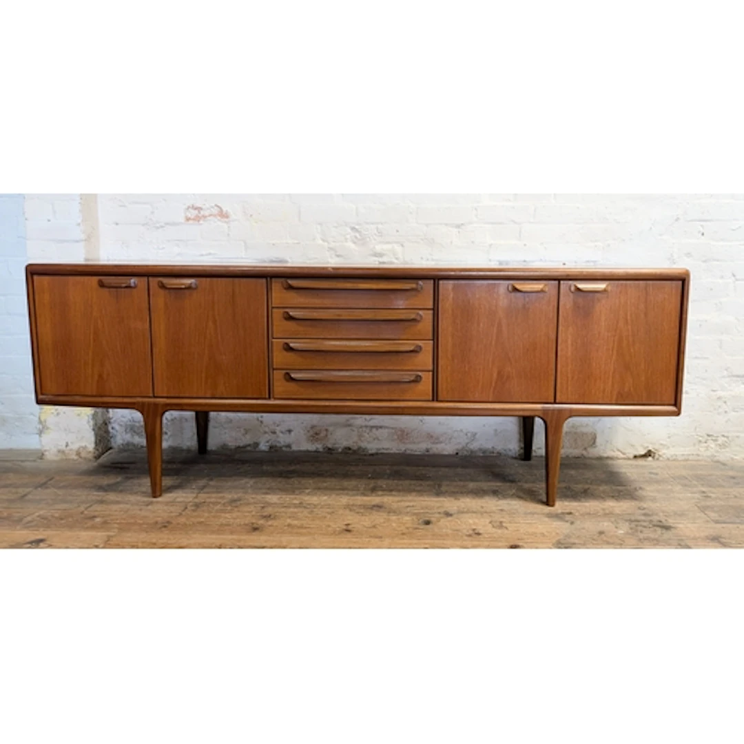 A 1960's/1970's Younger long low teak sideboard fitted centr...