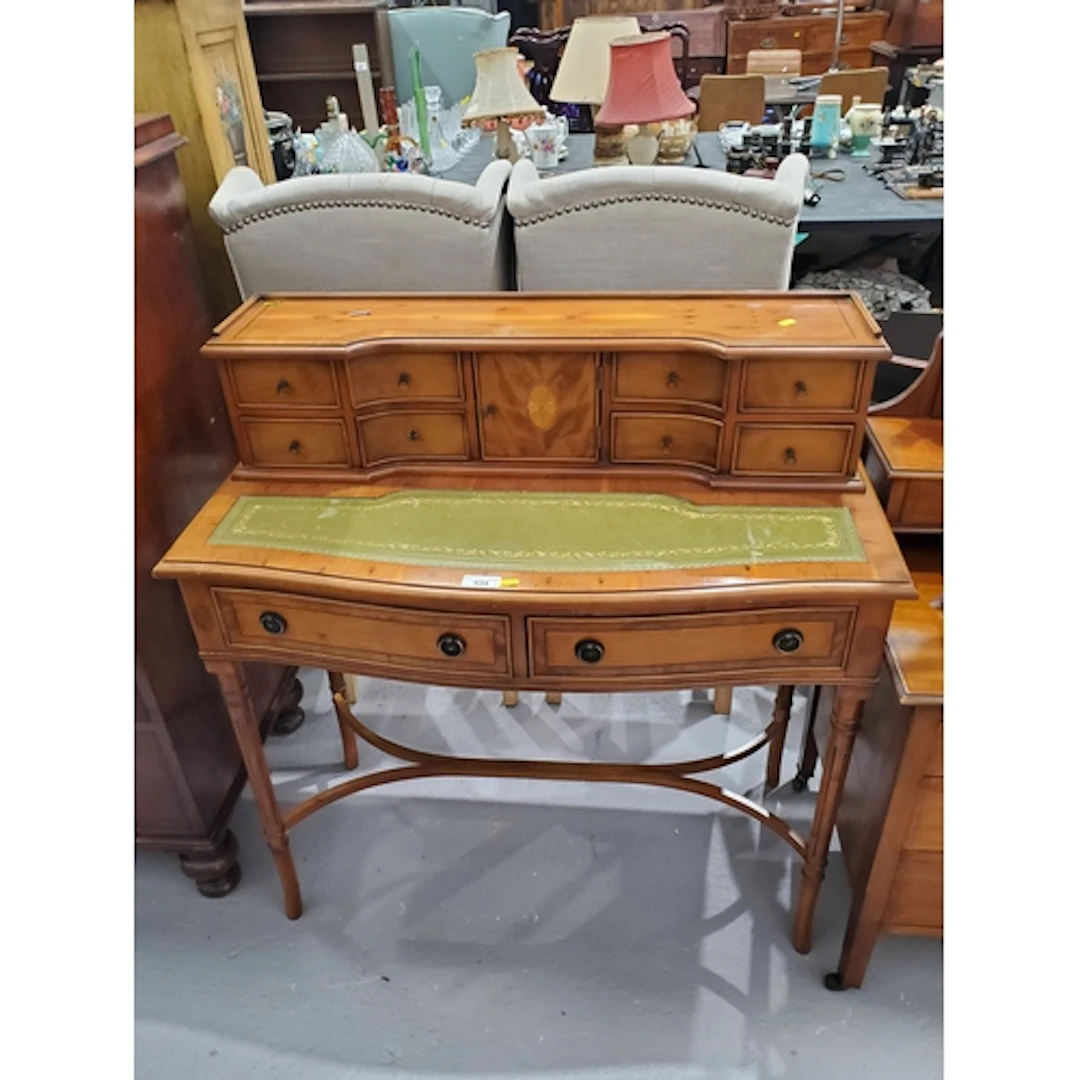 A reproduction writing Desk the raised back fitted eight dra...