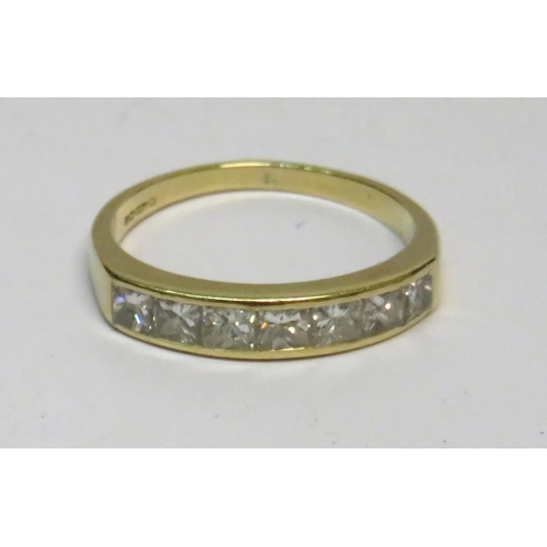 18ct Gold half eternity ring, set seven square cut diamonds,...