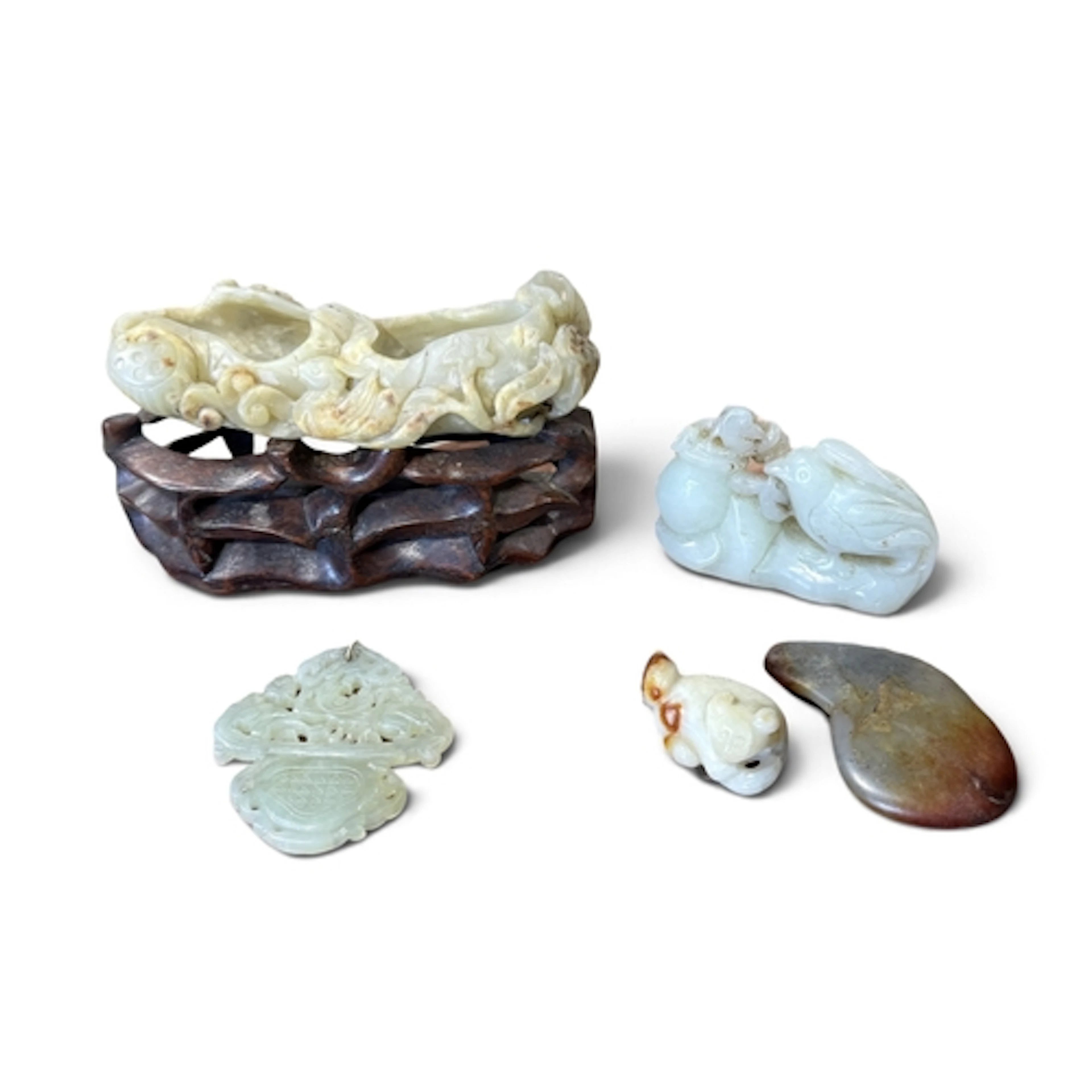 A COLLECTION OF CHINESE JADE ITEMS Largest 12cm. ...