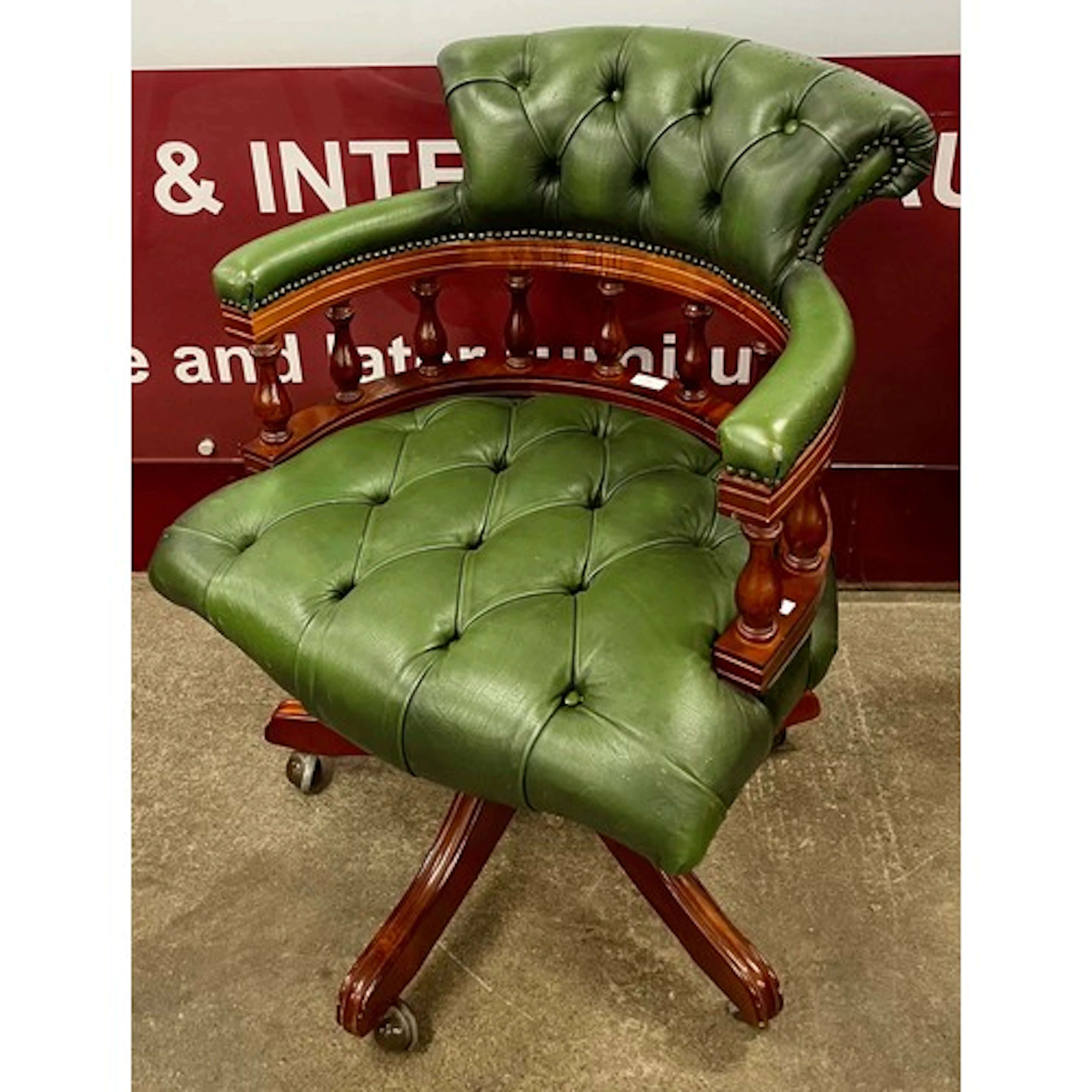 A Regency style mahogany and green leather revolving Captain...