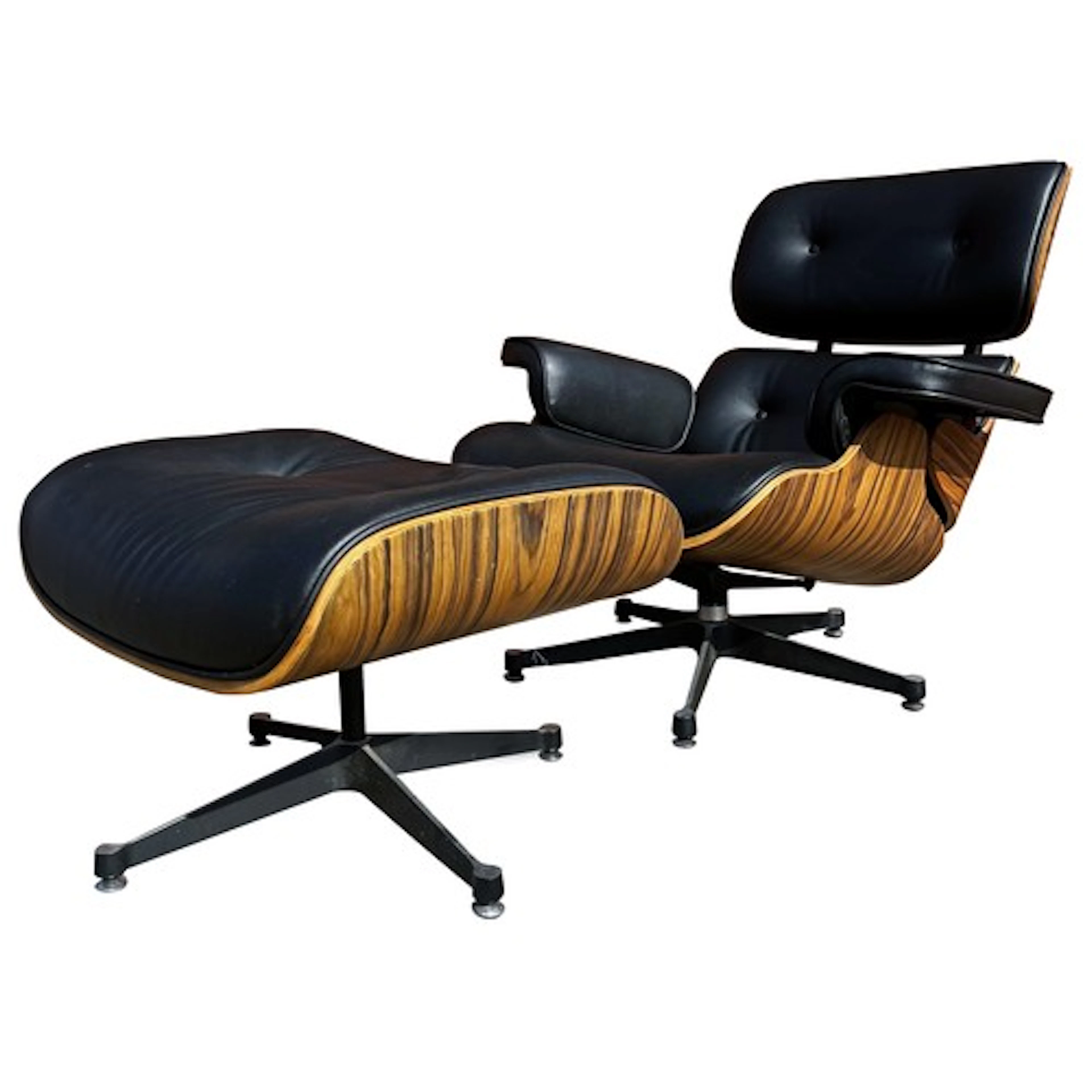 Eames style Mid-Century swivel lounge chair and ottoman. Bla...