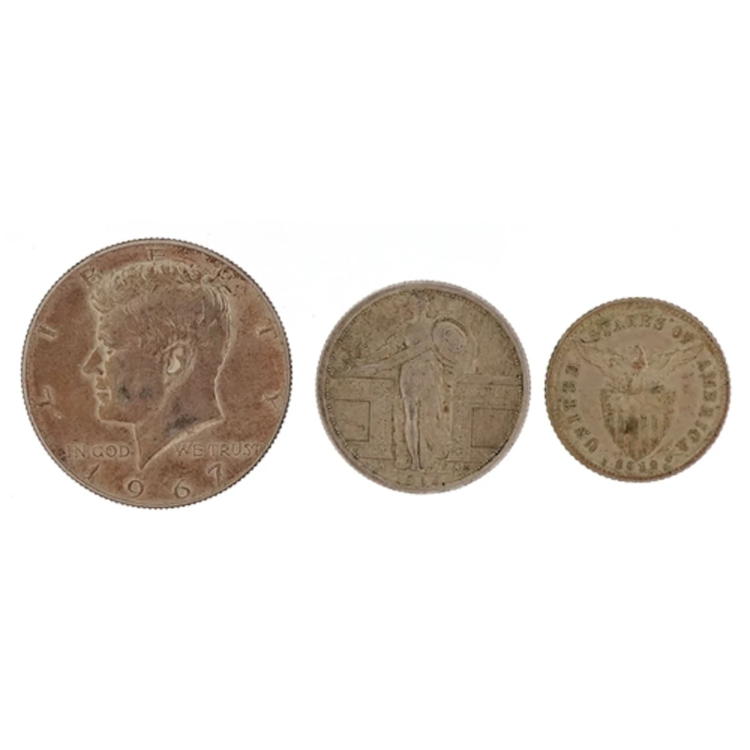 Three United States silver coins comprising Kennedy 1967 hal...