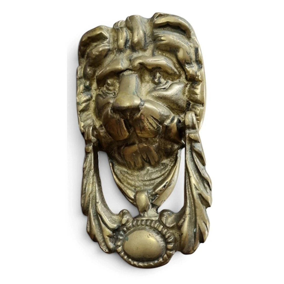 A Brass lion head door Knocker and a Cast Iron school Bell. ...
