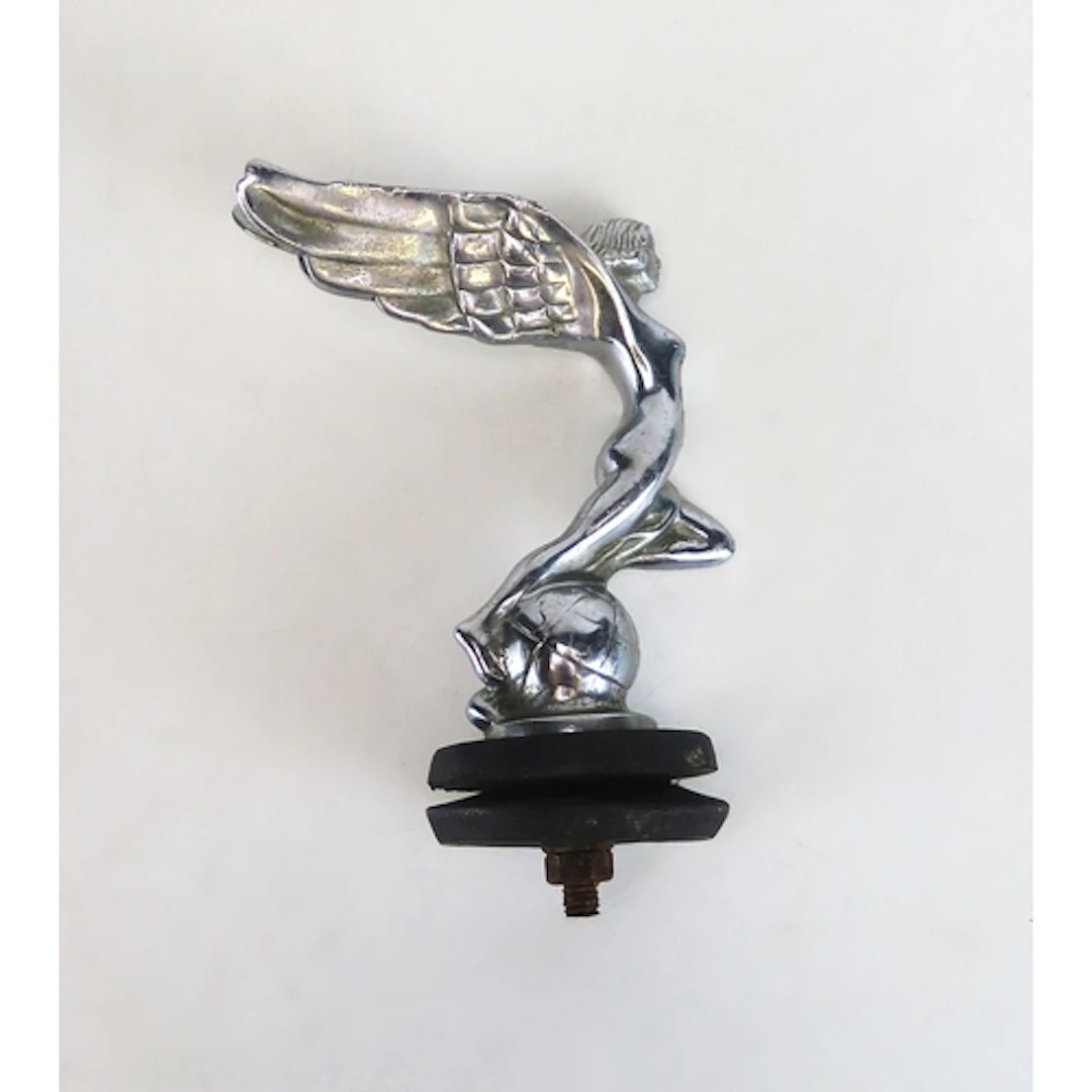 A Triumph chrome car mascot in the form of a winged nymph on...