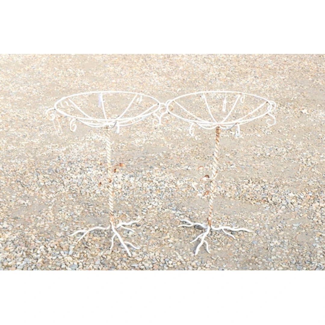 Pair of wrought iron white painted plant stands having scrol...