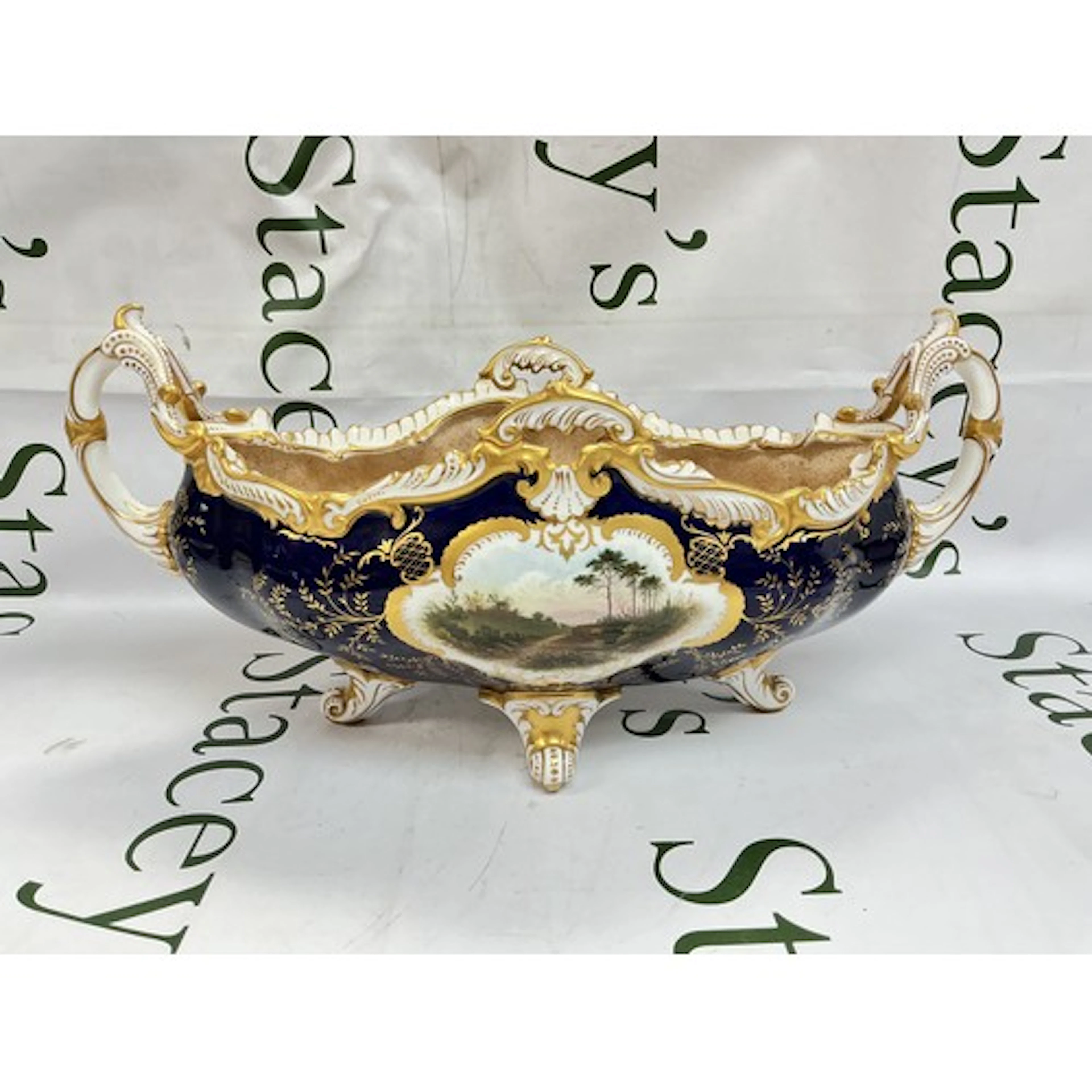 An early 20th century Coalport Hampton pattern two handled b...