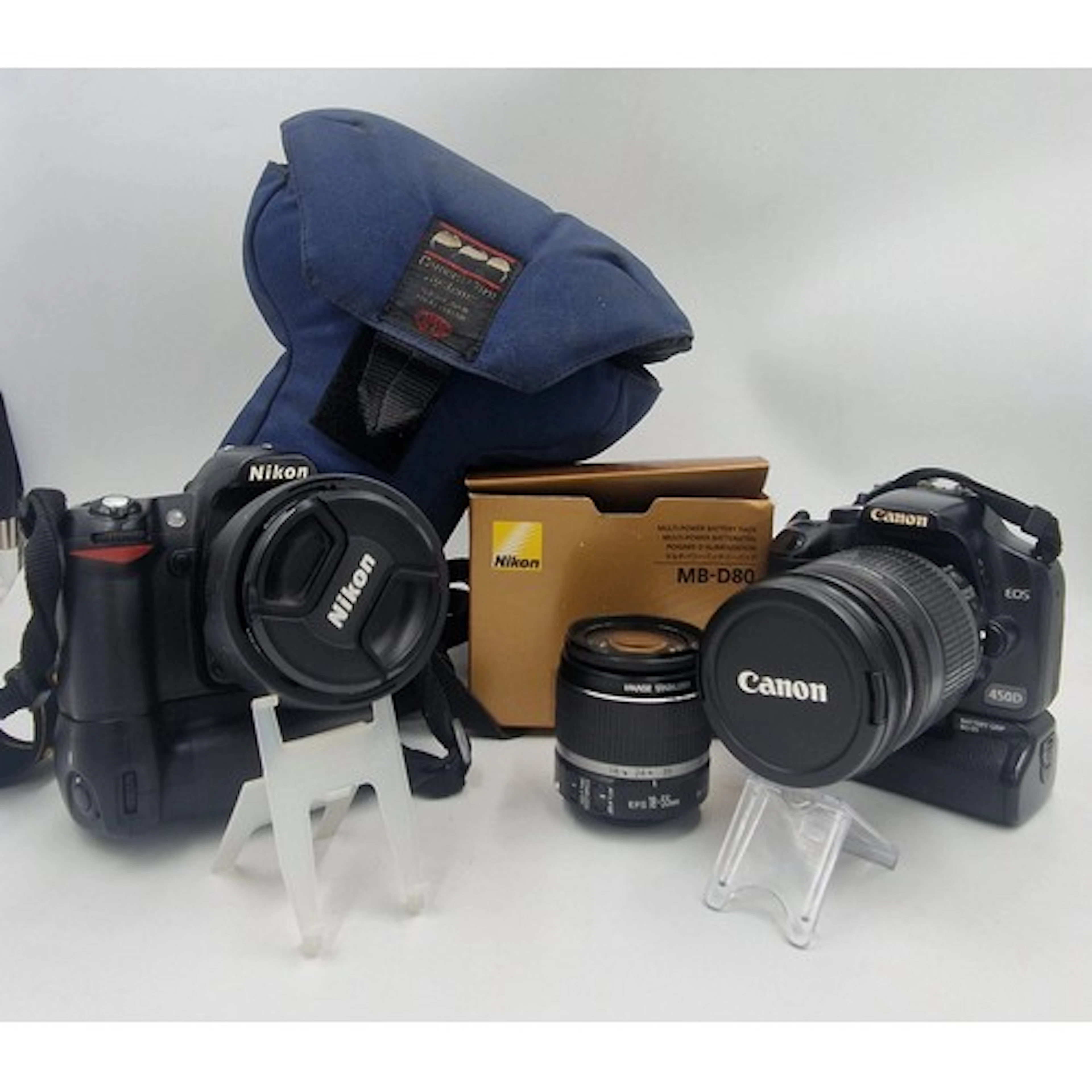 A pair of Digital SLR Cameras and accessories to include a C...