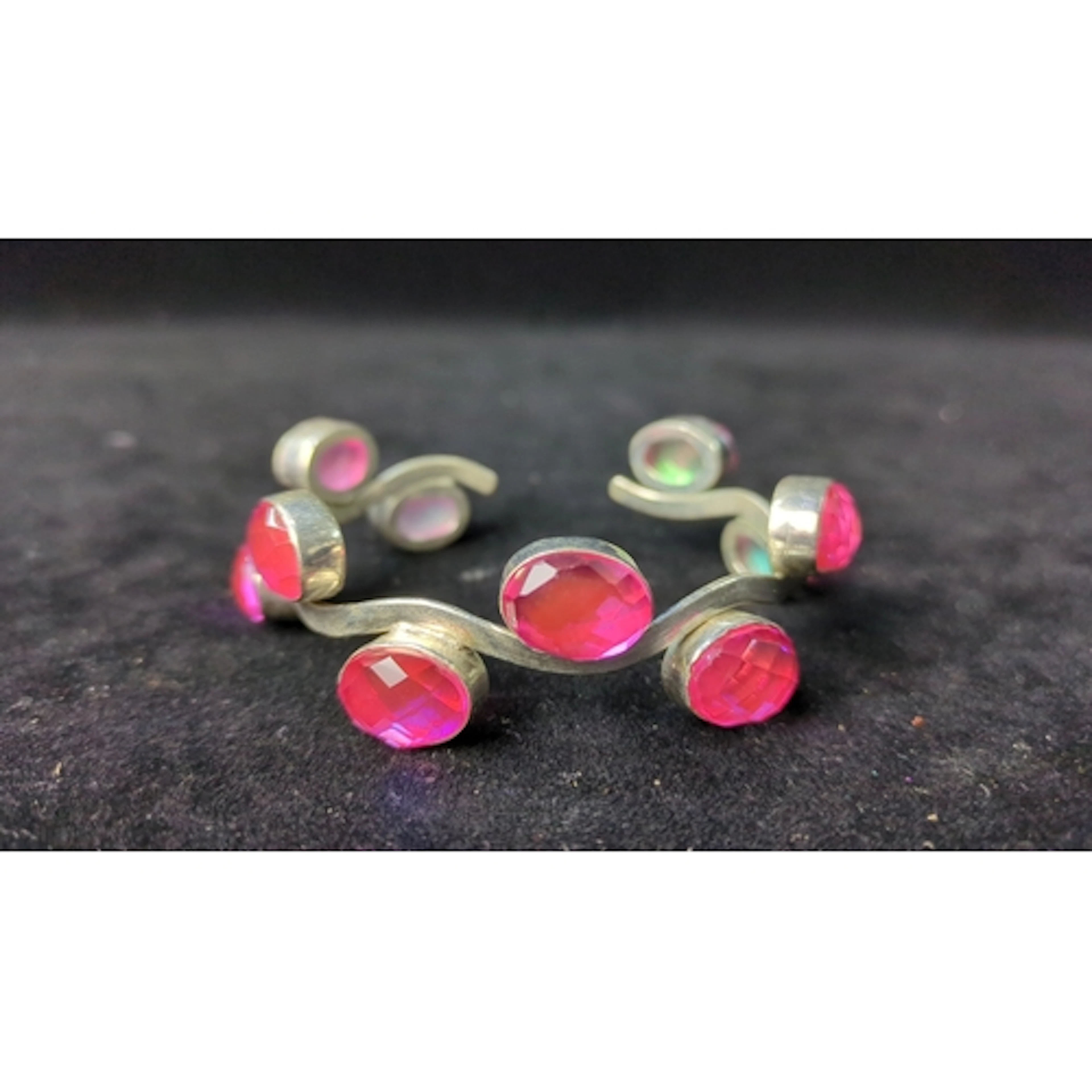Sterling silver open cuff bracelet with an undulating band a...