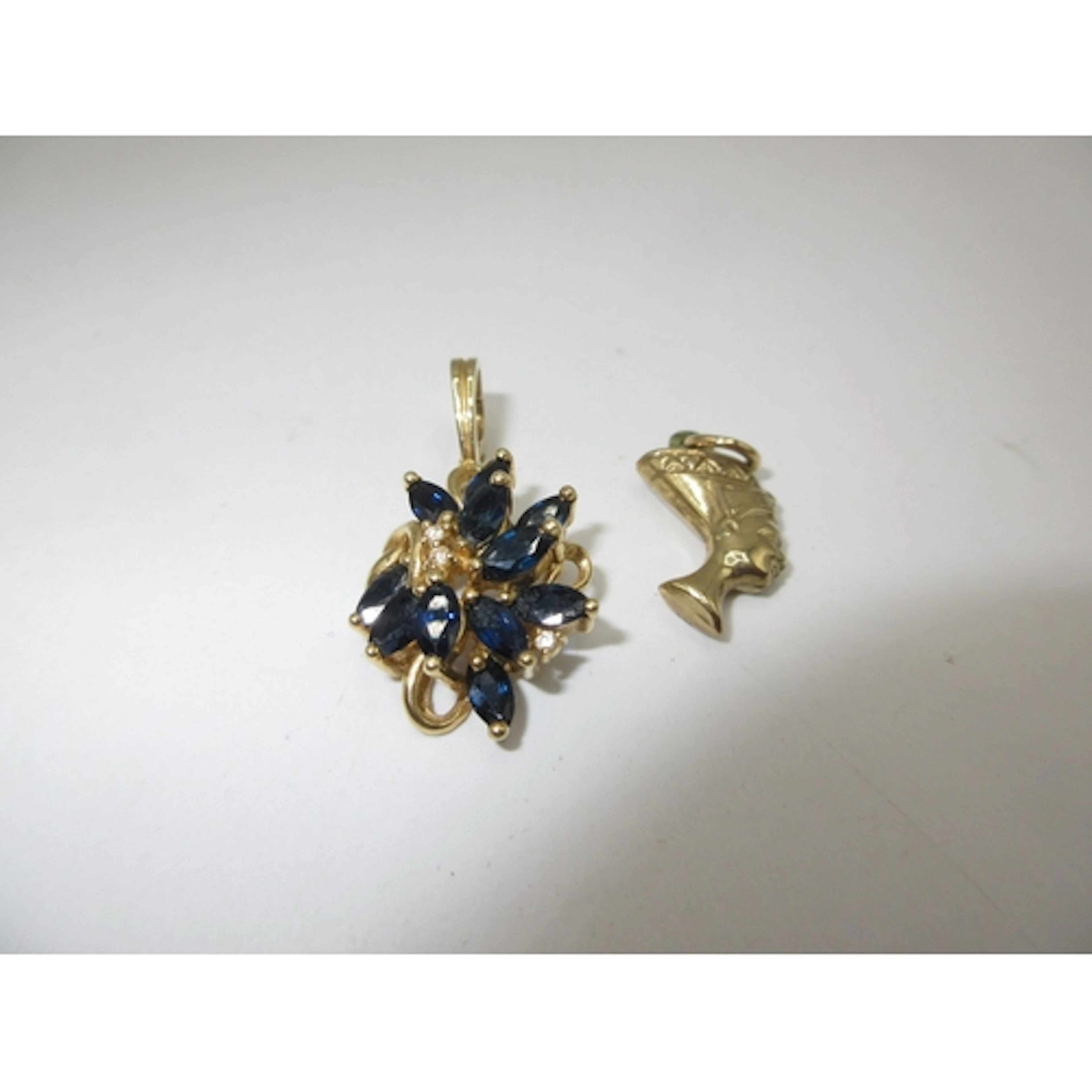 9ct Gold Nefertiti Pendant and a 9ct Gold Gem Set Pendant
