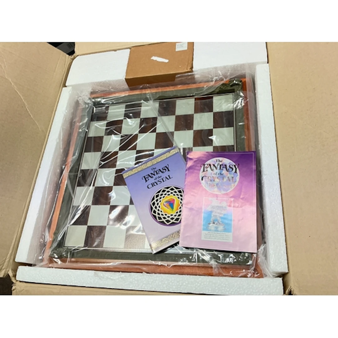 A Danbury Mint The Fantasy Of The Crystal Pewter Chess Set.