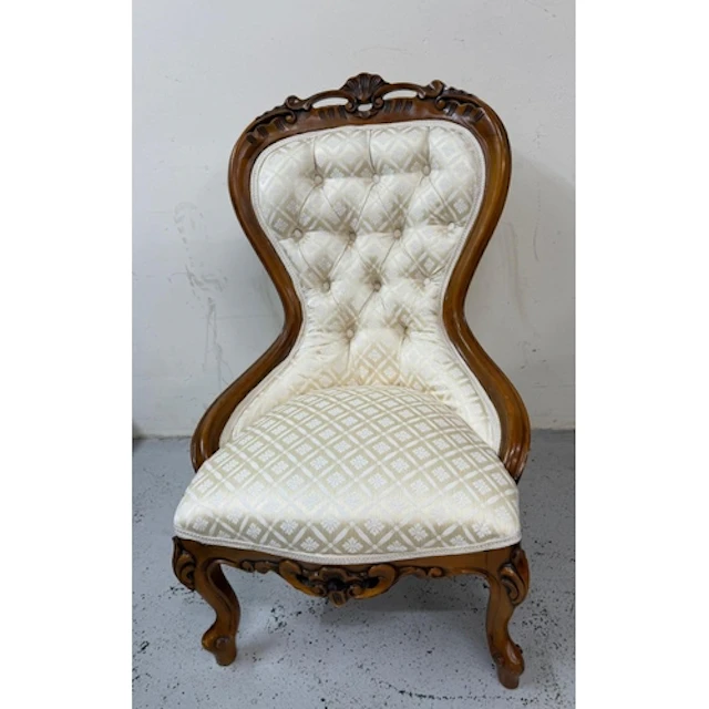 A Victorian slipper chair with spoon back and damask fabric...