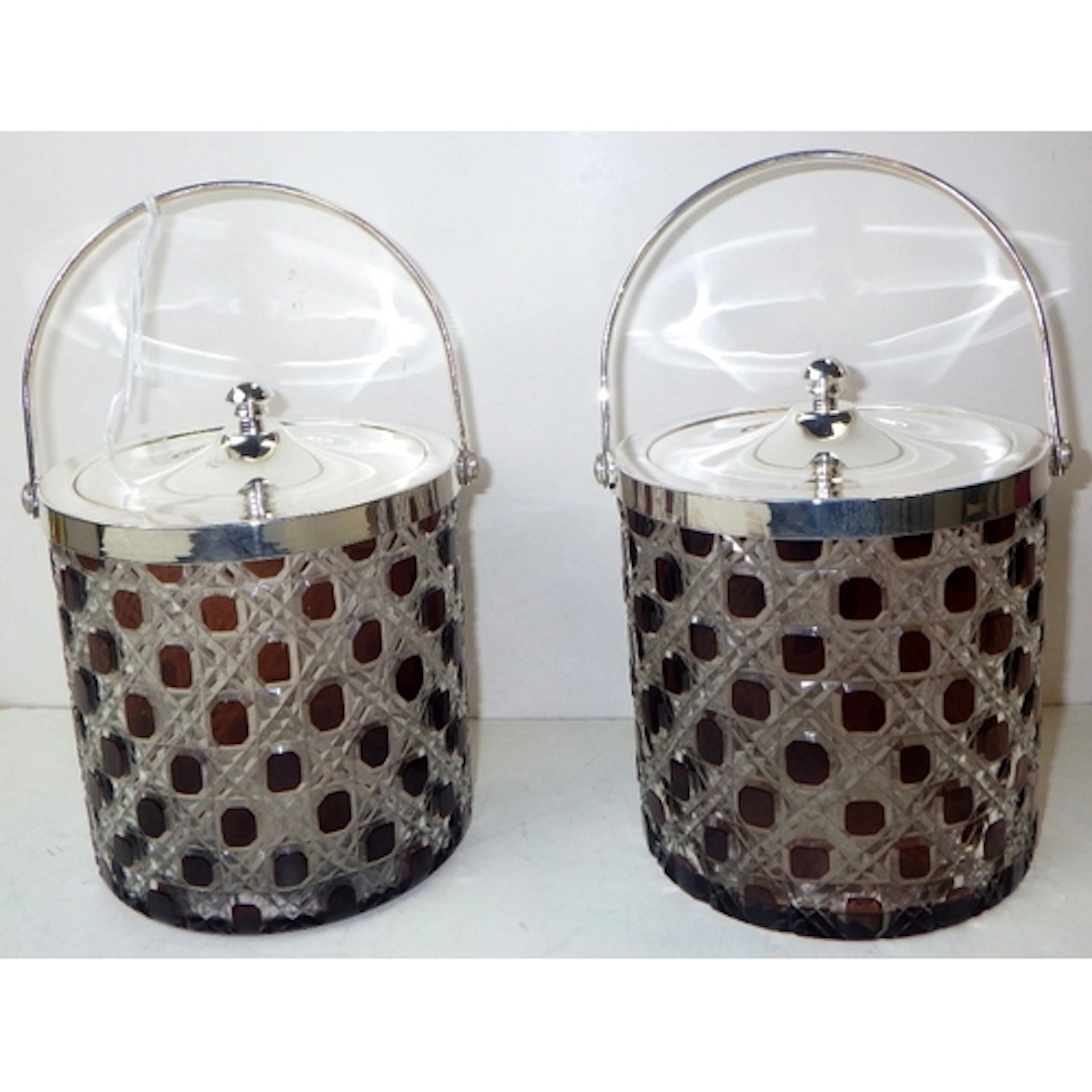 A pair of silver plated biscuit barrels