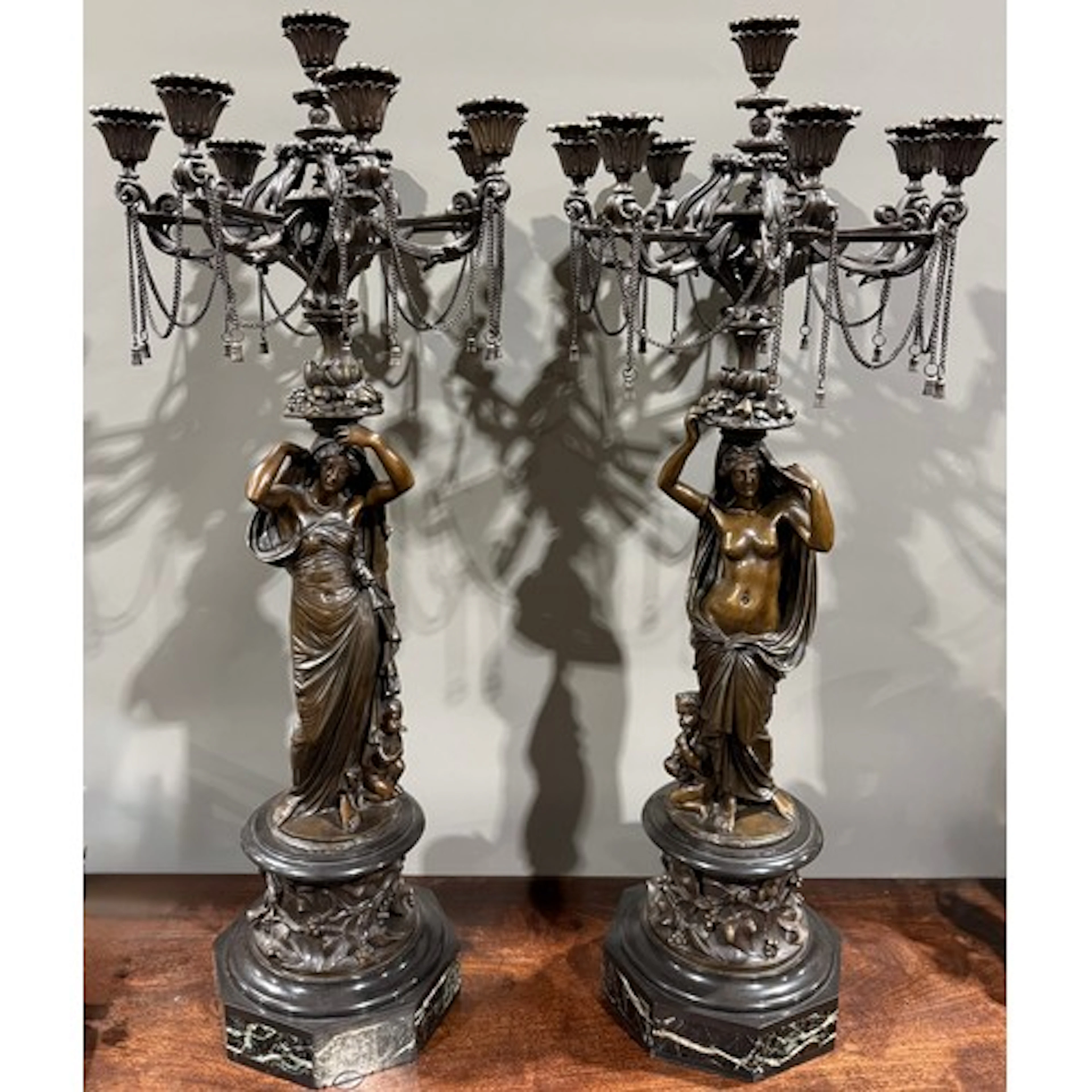 A pair of 19th century French bronze eight-light figural can...
